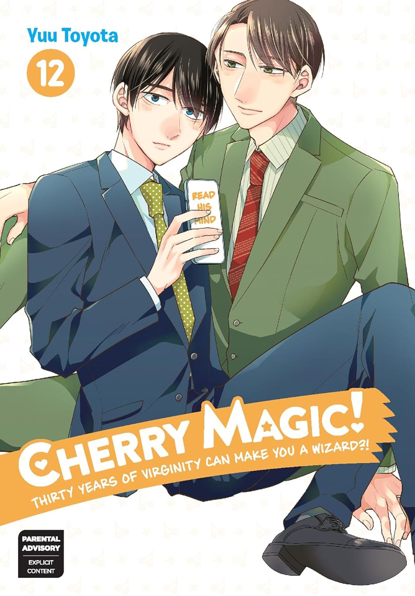 Title image for Cherry Magic!, Vol. 12. Two men in business suits sit on the ground, the one in a green suit leans on his hip and hand while the one in a blue suit leans back against his legs and chest.