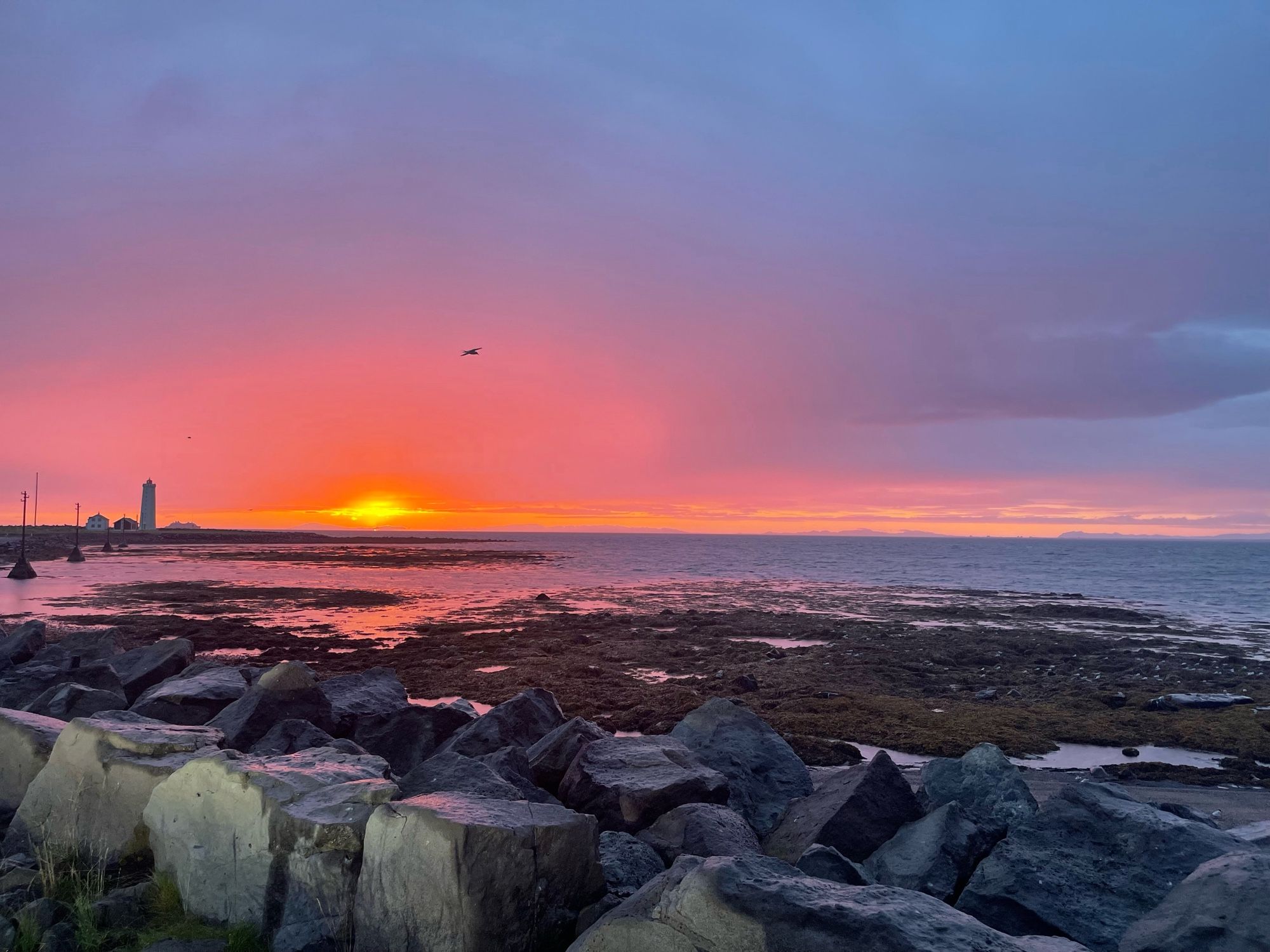 Sunset over a lighthouse in Iceland