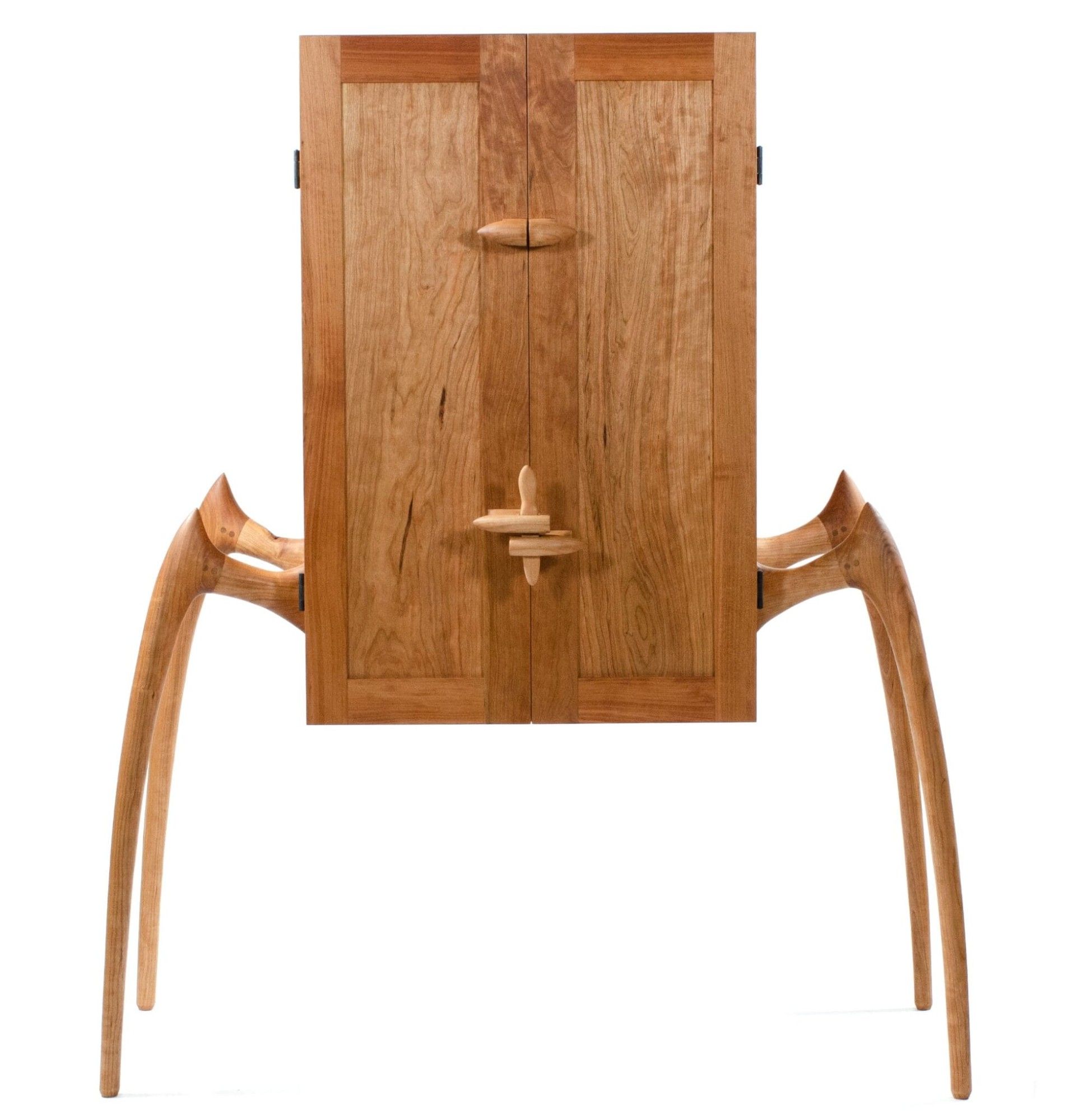 a wood cabinet with insect-like legs