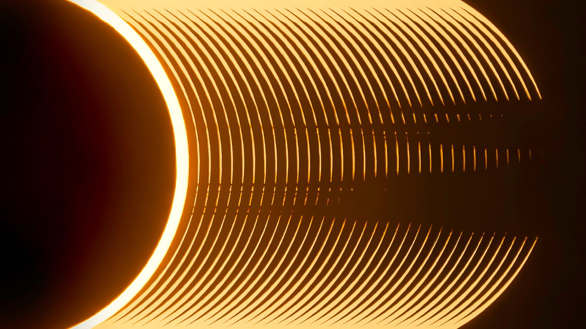 an abstract image of the sun with glowing rings that appear to grow from the right side