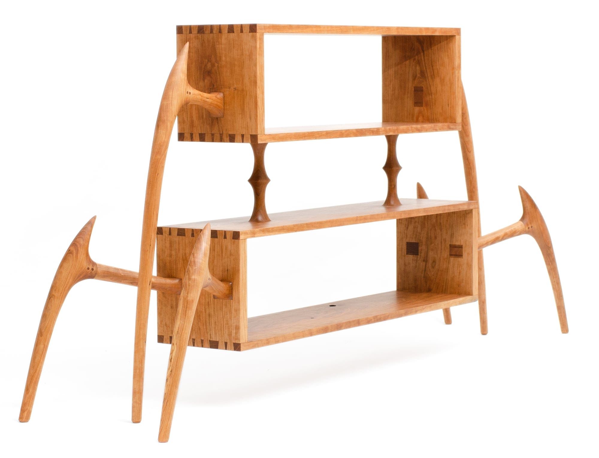 a wood bookshelf with insect-like legs