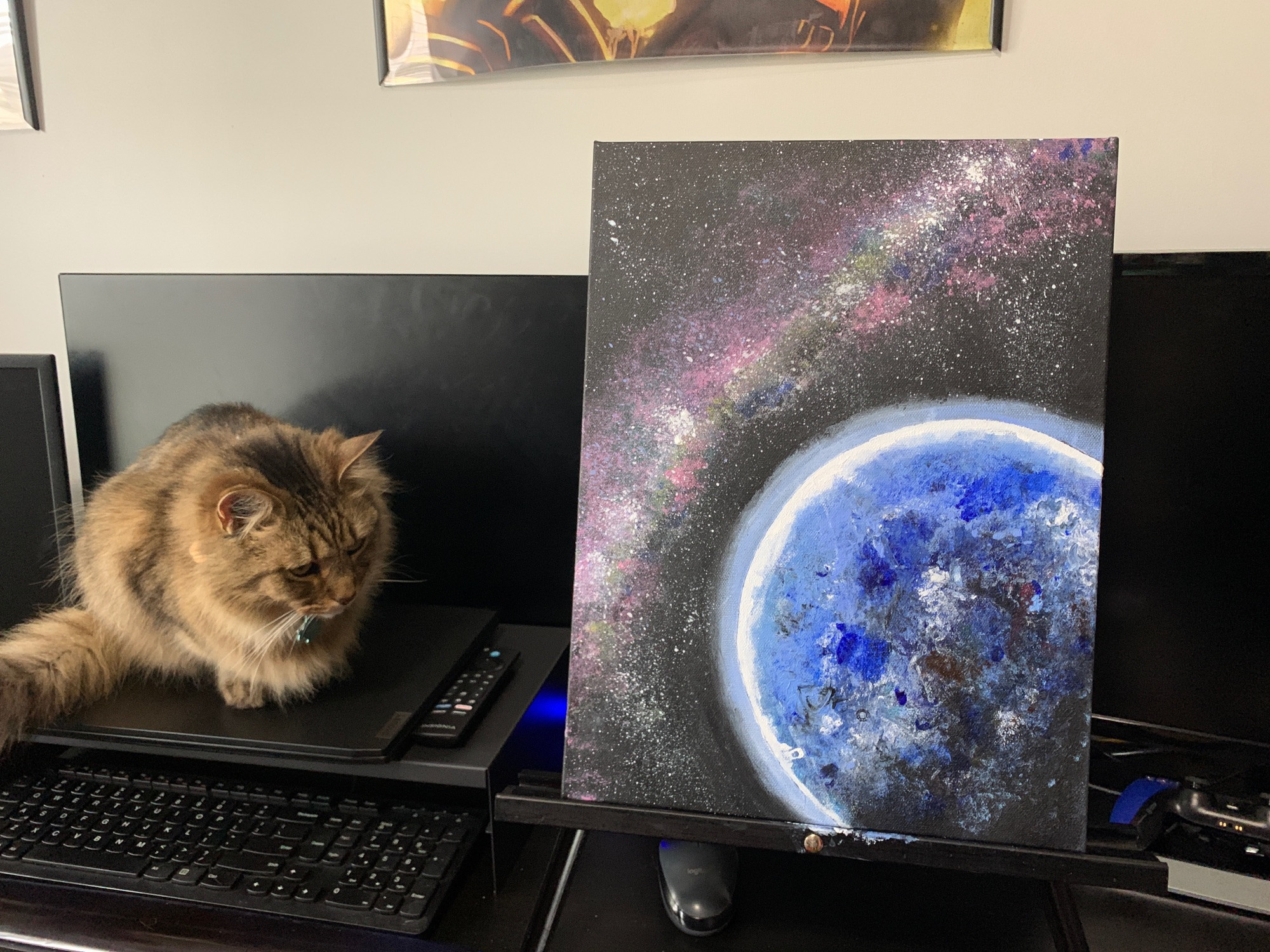 Acrylic painting on canvas of planet and galaxy.