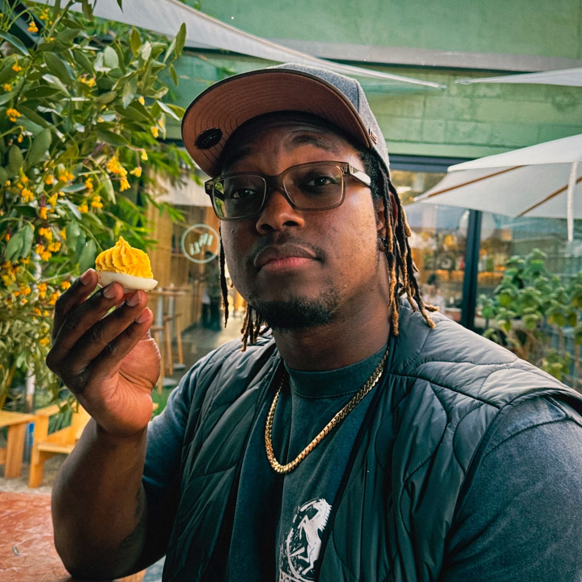 ify nwadiwe holds a deviled egg