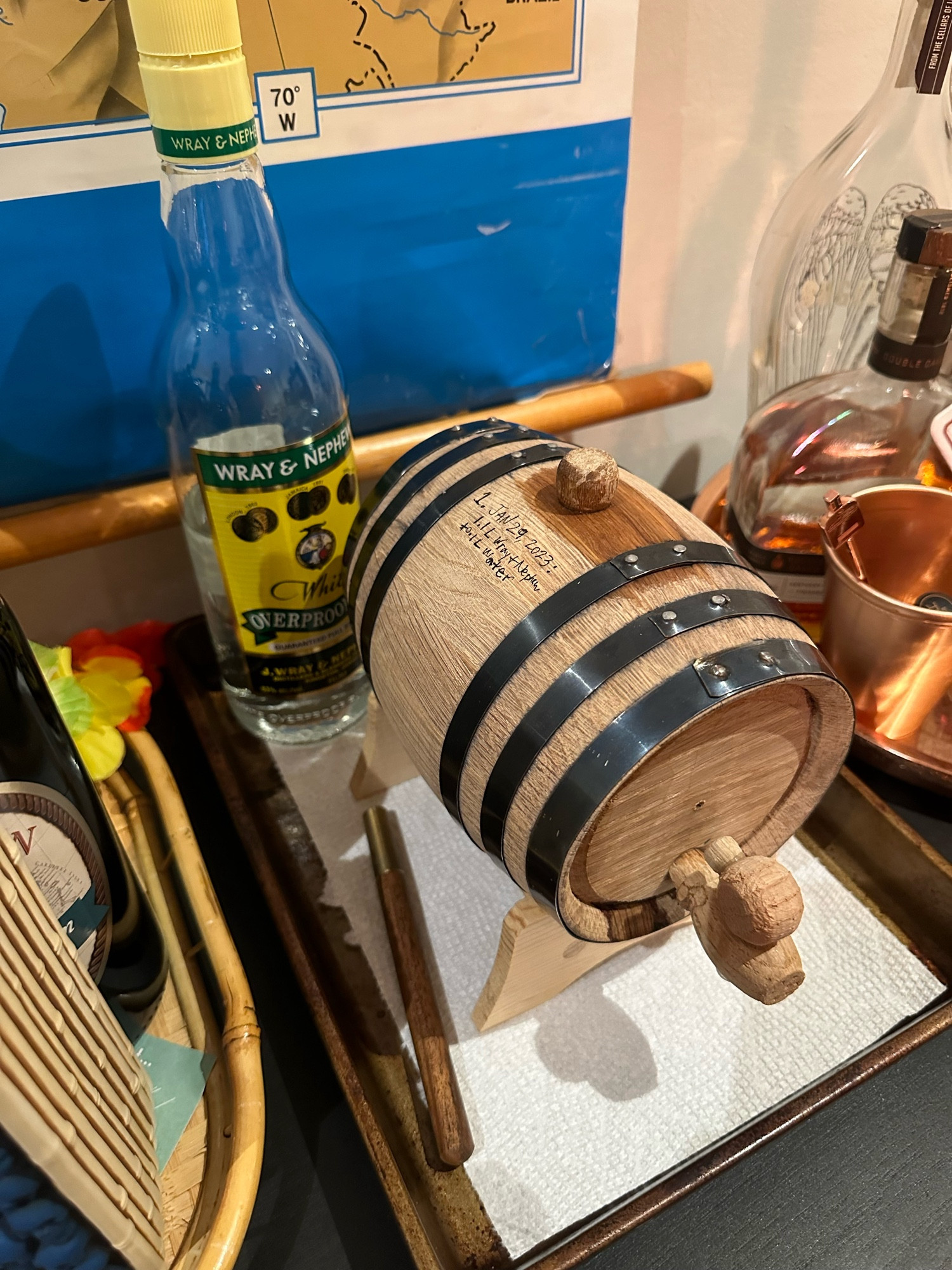 Barrel, recently filled with Wray & Nephew, with a partial bottle behind it.