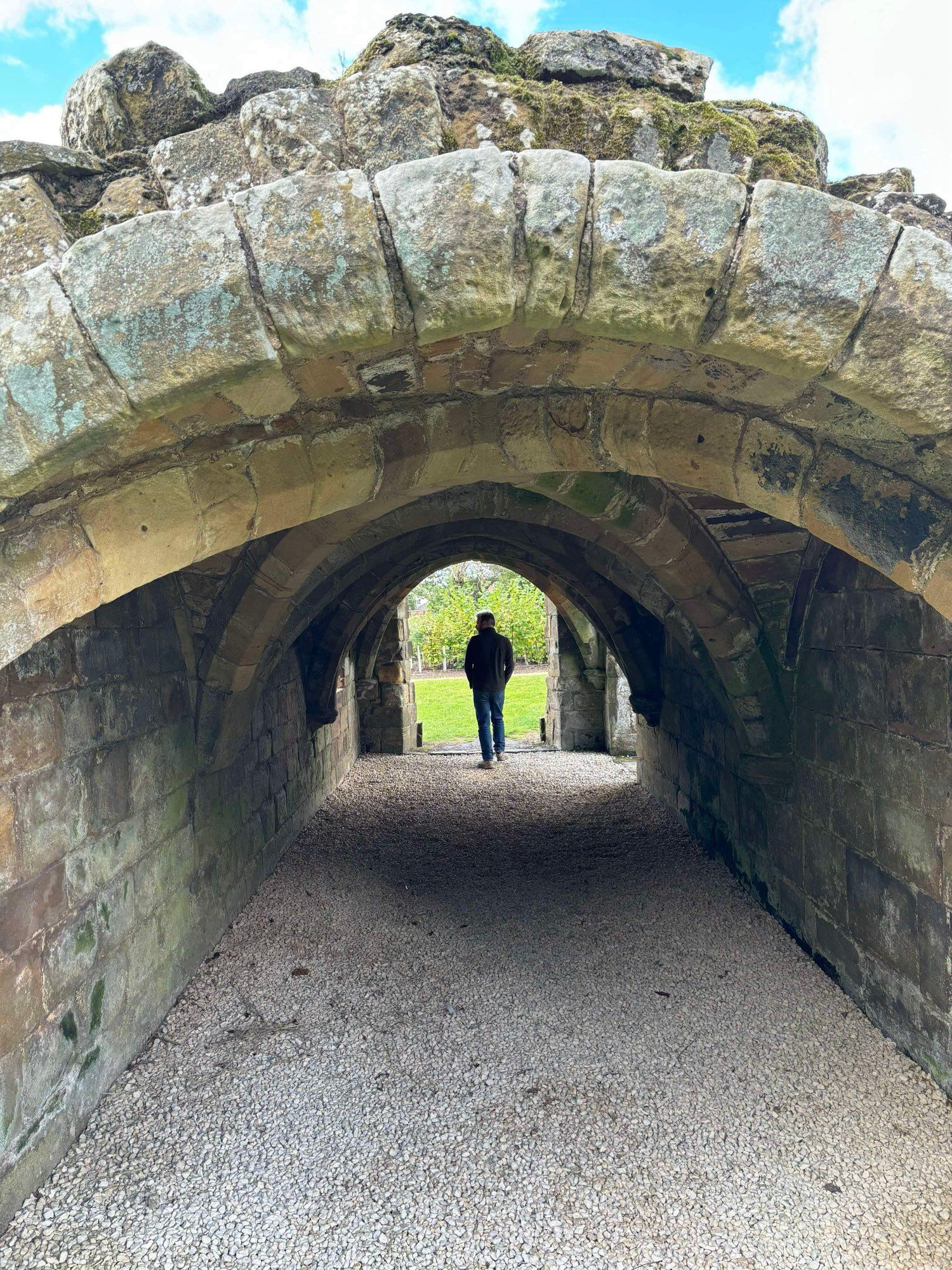 Me stepping through an arch in Guisborough Priory ruins