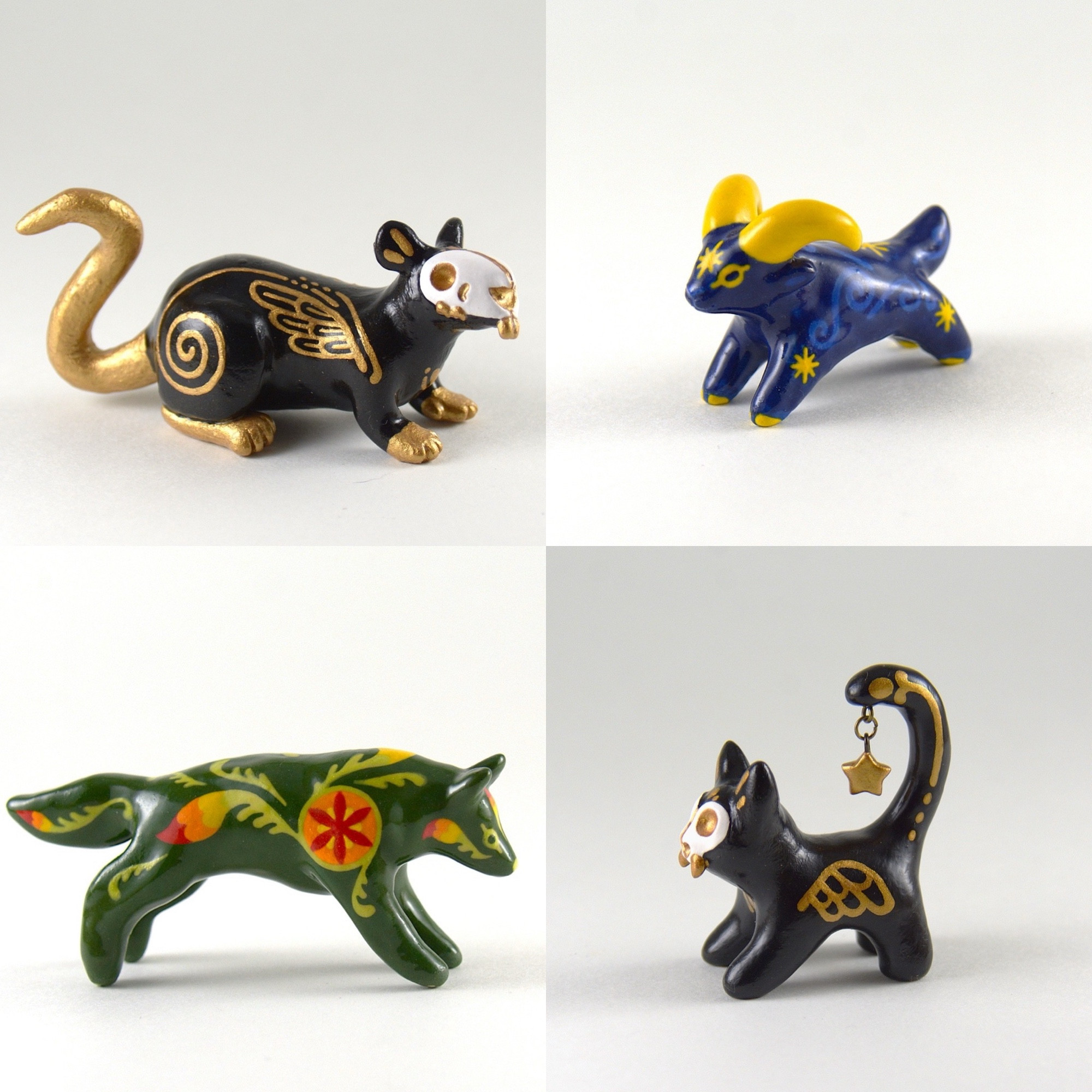 Four different pictures of small animal sculptures. The top left is a black and gold rat with a skull for a face. The top right is a little blue and yellow goat with star motifs. The bottom left is a green wolf with rainbow floral patterns. The bottom right is a black cat with gold details, a skull mask, and a star charm hanging from its tail.