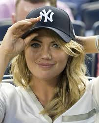Kate Upton adjusting her Yankees hat 