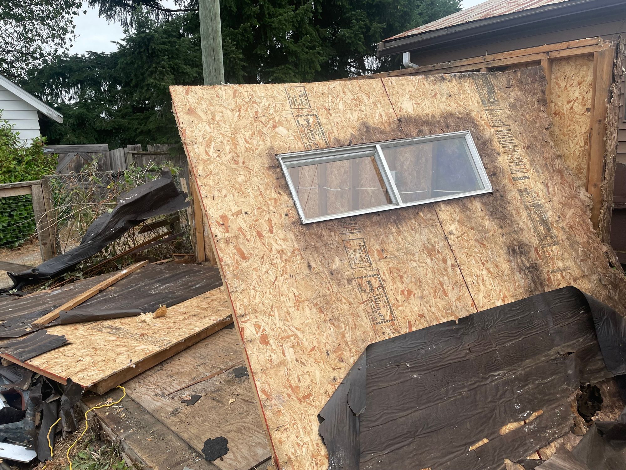 now the closest sidewall is tipping over ready to fall onto the ground on top of the other wall