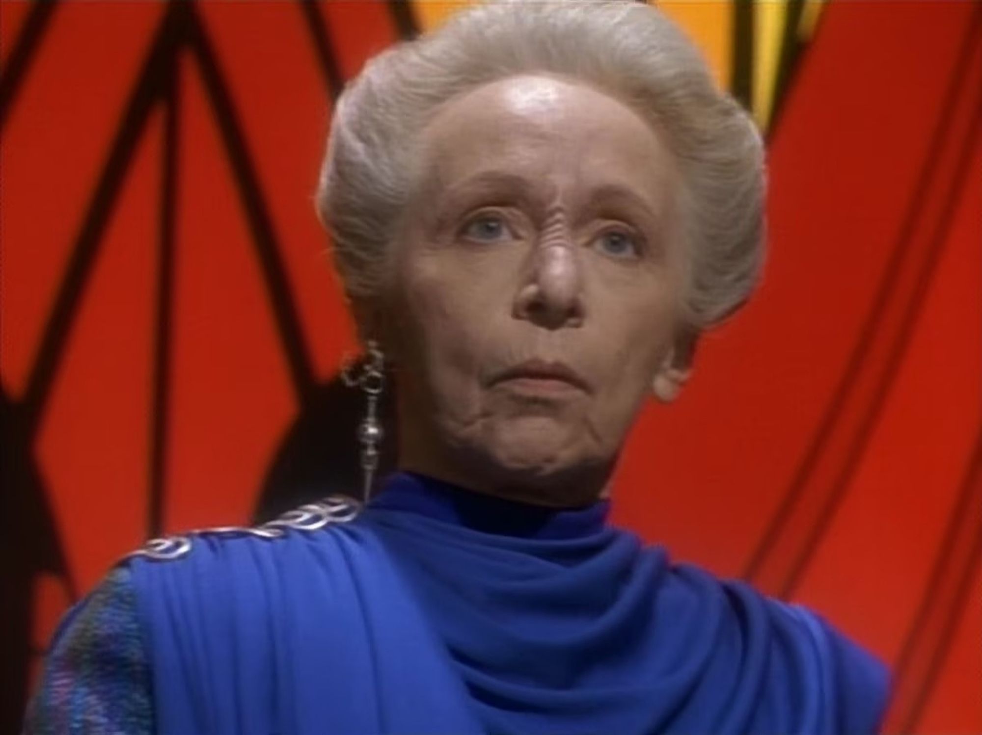 A screenshot from Star Trek: Deep Space Nine of the Trill arbiter, Els Renora.