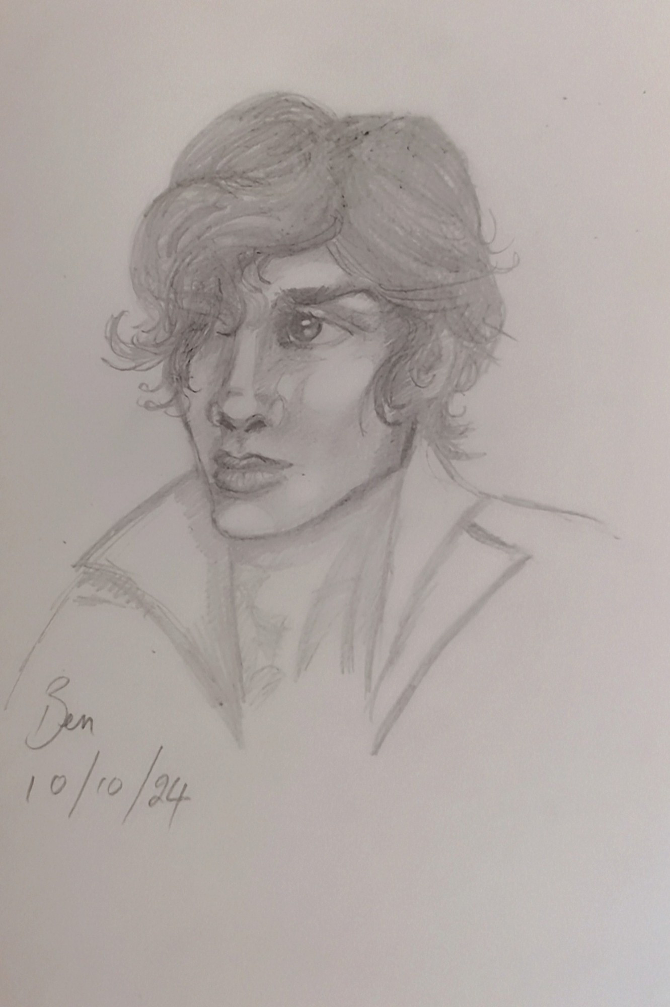 Pencil sketch of a young man with large dark eyes and floppy hair over one side of his face