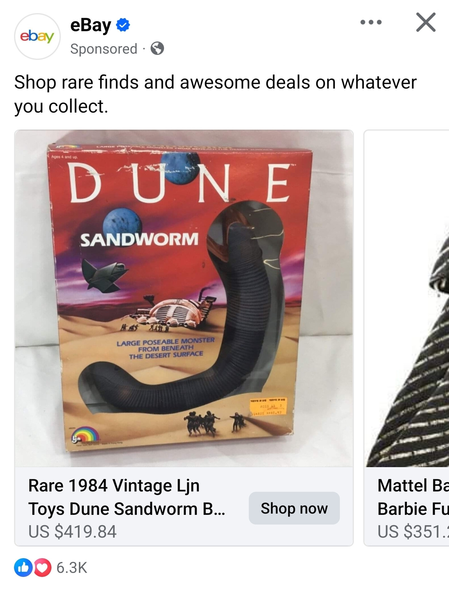 Facebook ad for eBay that shows an item listing entitled "Rare 1984 Vintage Ljn Toys Dune Sandworm..." priced at $419.84. The photo of the item is a box depicting a desert landscape with yellowish sand and a red sky with two blue moons and some kind of spacecraft flying through the air. In the background is a white and red spacecraft on the ground. In the foreground is an enormous, black, wormlike creature that, I swear to God, is shaped like a g-spot dildo. There are also teeny tiny people in silhouette in front of the creature.

At the top of the box, it says "DUNE" in really big letters with "SANDWORM" in smaller letters under it. Closer to the bottom, it says "LARGE POSEABLE MONSTER FROM BENEATH THE DESERT SURFACE" in small blue letters. There's a little logo in the bottom left of the box that has a rainbow and the letters "ljn"