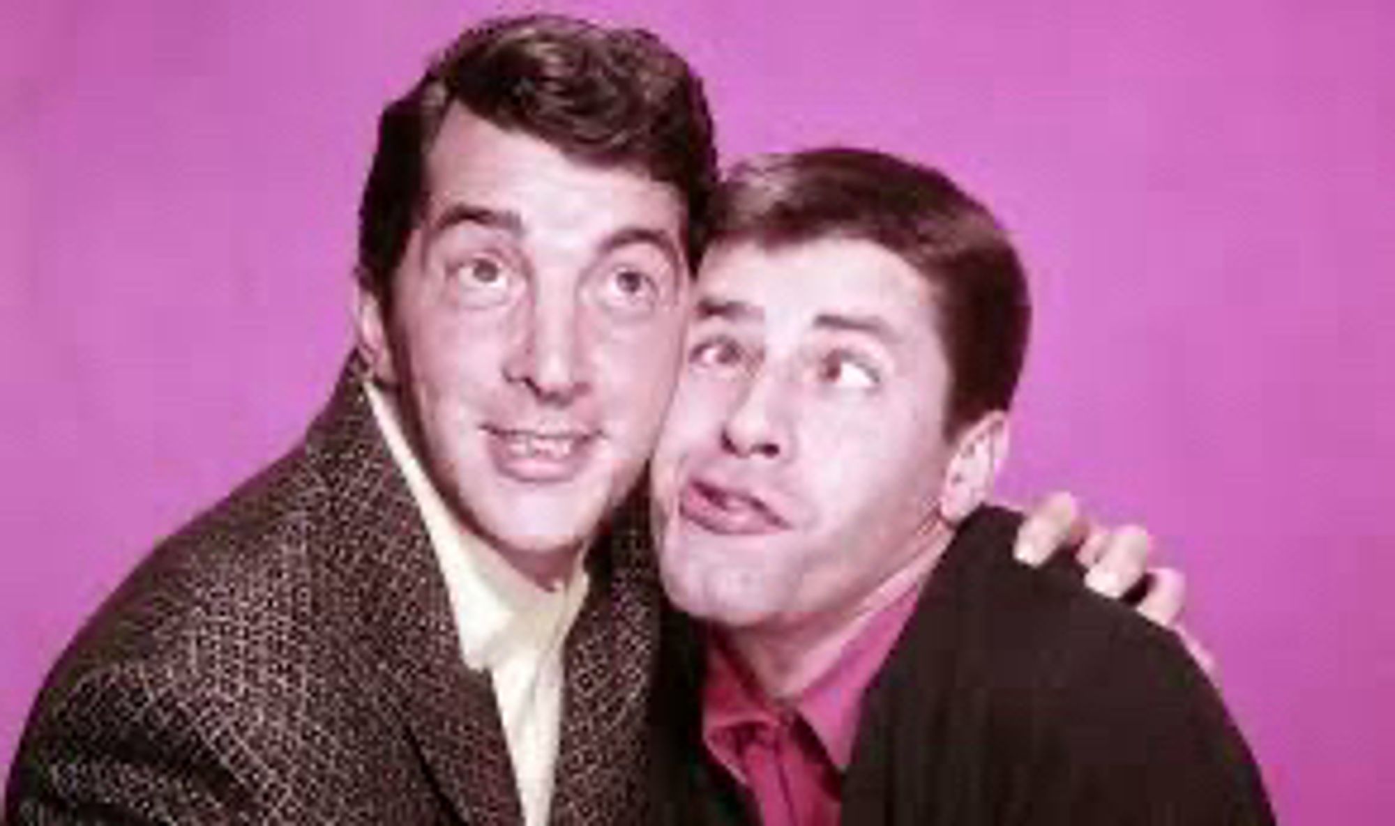 Photo of Dean Martin & Jerry Lewis hugging each other and making goofy faces.