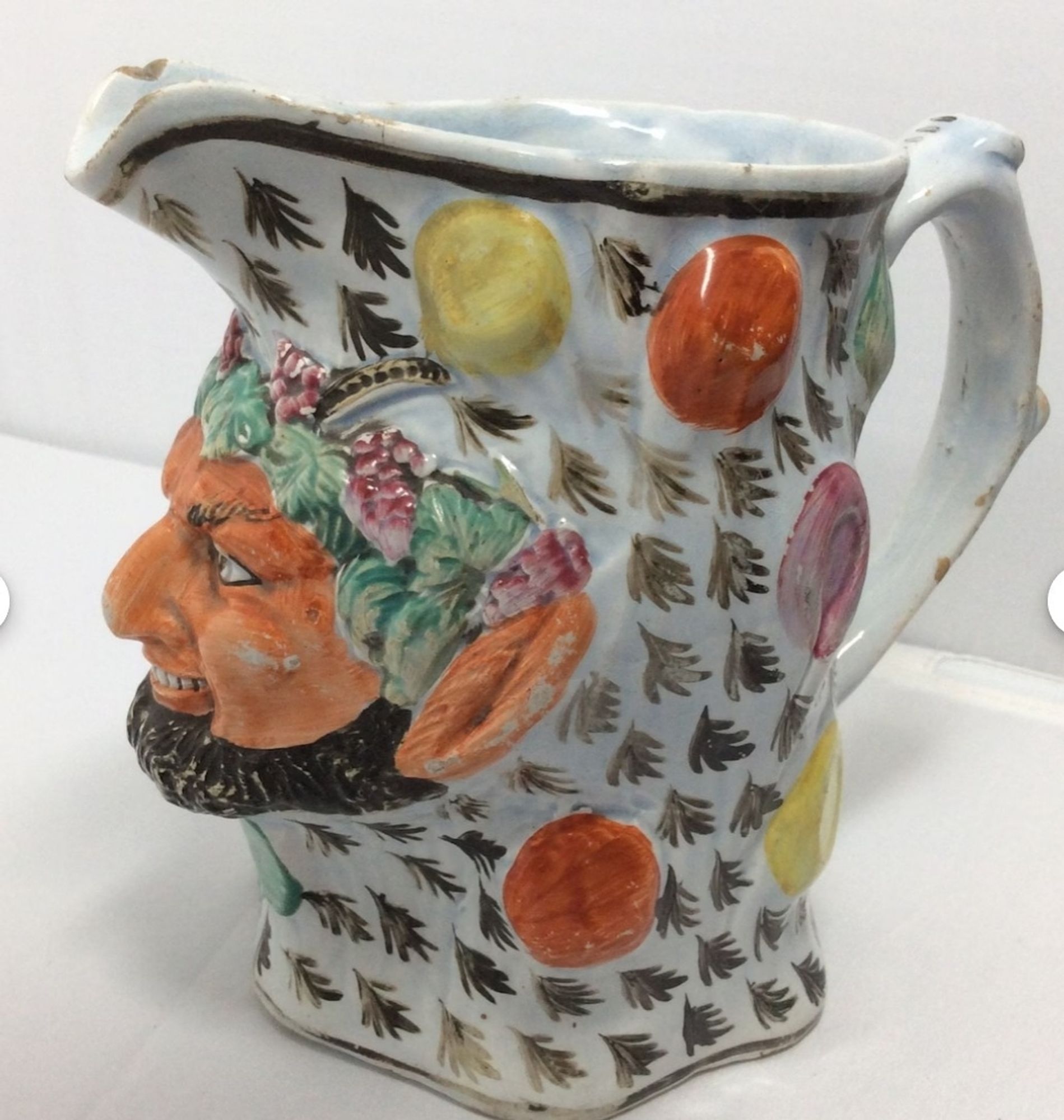 Another character jug, in this one the polka dots are larger and 3D and are beginning to resemble fruit, he also has vines around his forehead and a bit of devilry in his expression