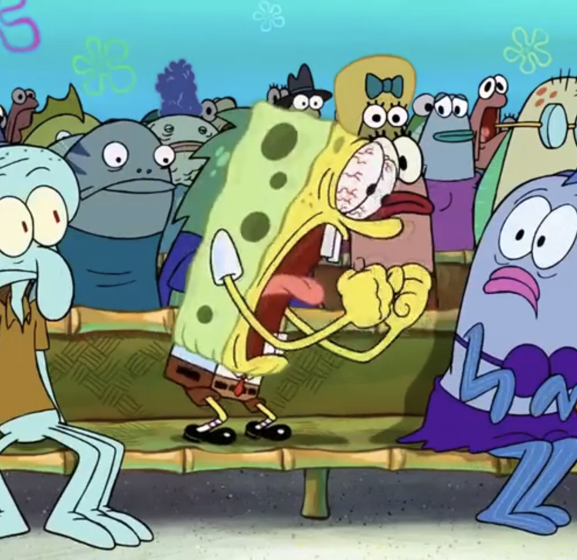 spongebob screaming at someone next to him while the rest of the crowd looks at him in shock