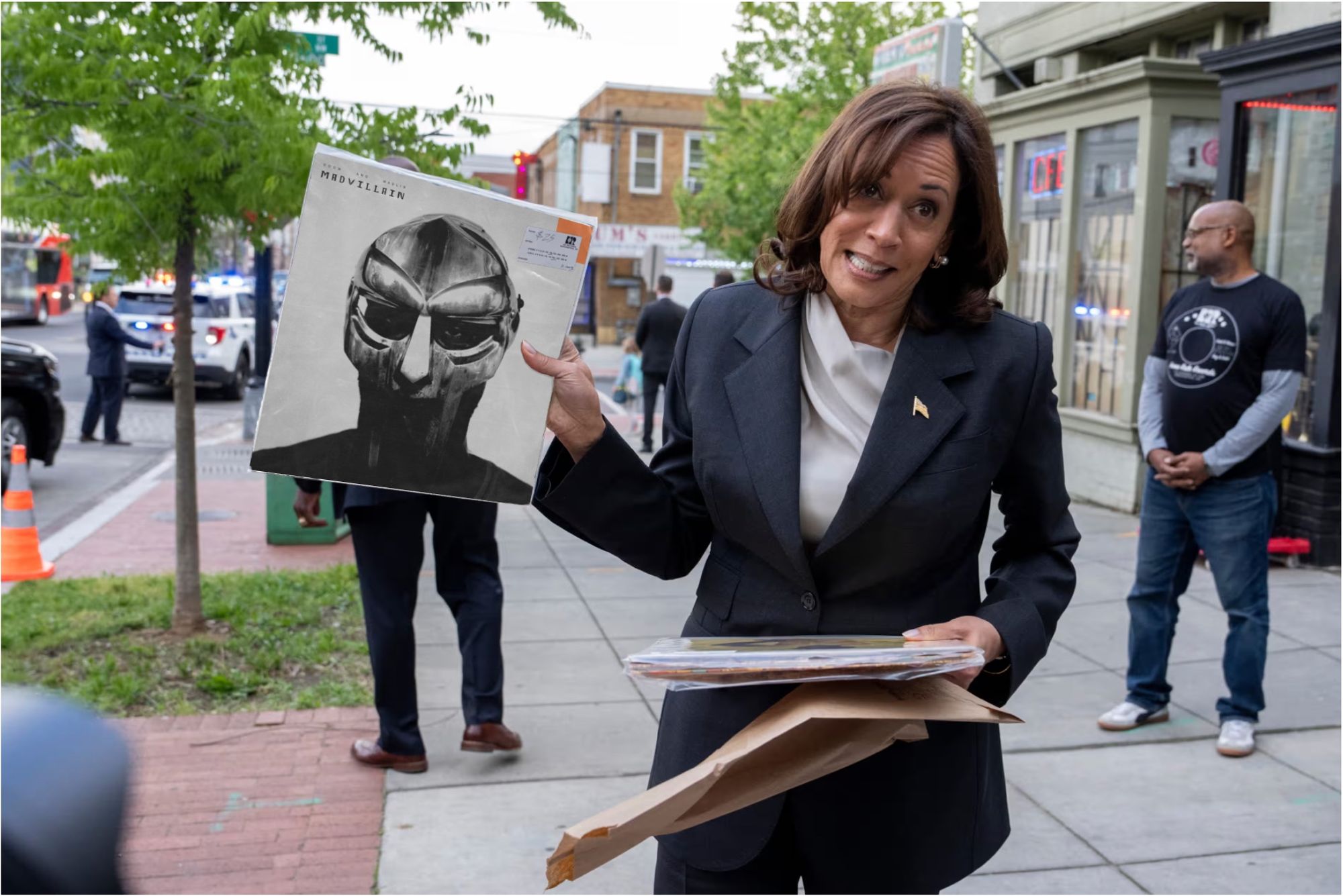 An edited image of Vice President Kamala Harris on a sidewalk in Washington, D.C., appearing to hold (but not in real life holding) the record 'Madvillainy' by Madvillain.