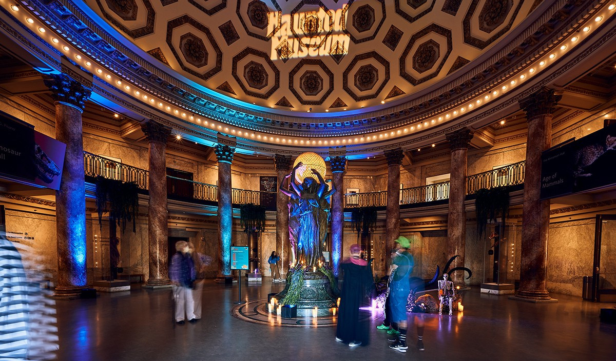 Costumed attendees visit the Rotunda at NHMLA's Haunted Museum event.