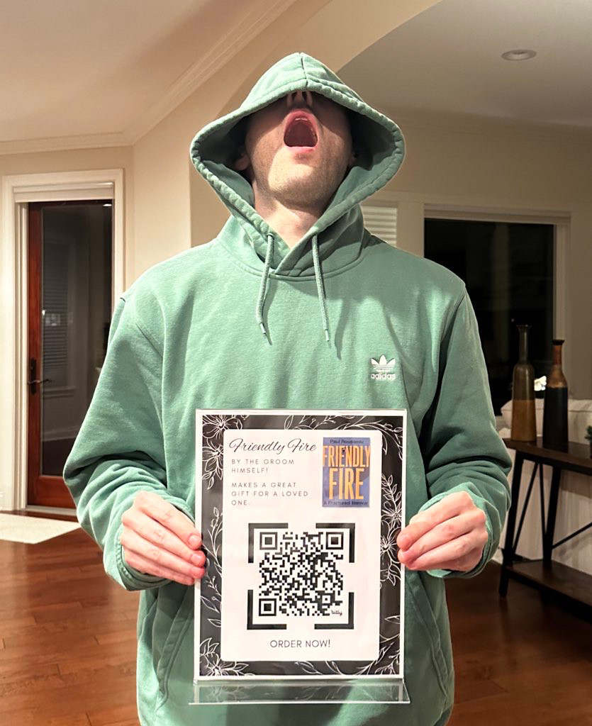 me in a green hoodie hood over my head in a goofy way with a QR code flyer for friendly fire "written by the groom"