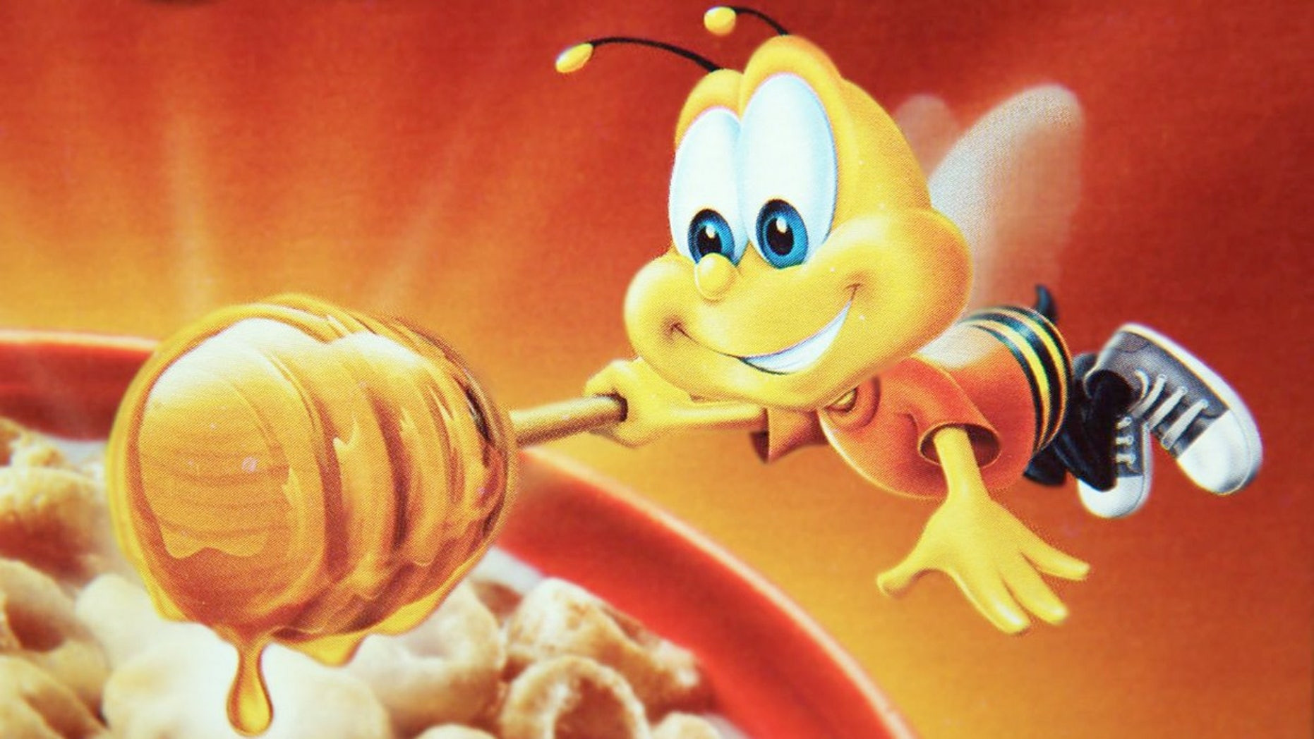 Box with an anthropomorphic bee mascot, wearing an orange shirt and black and white canvas shoes 