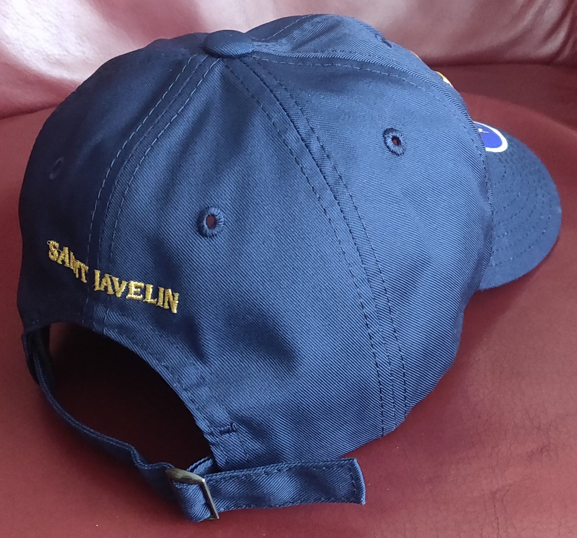 On back of hat, embroidered text: Saint Javelin