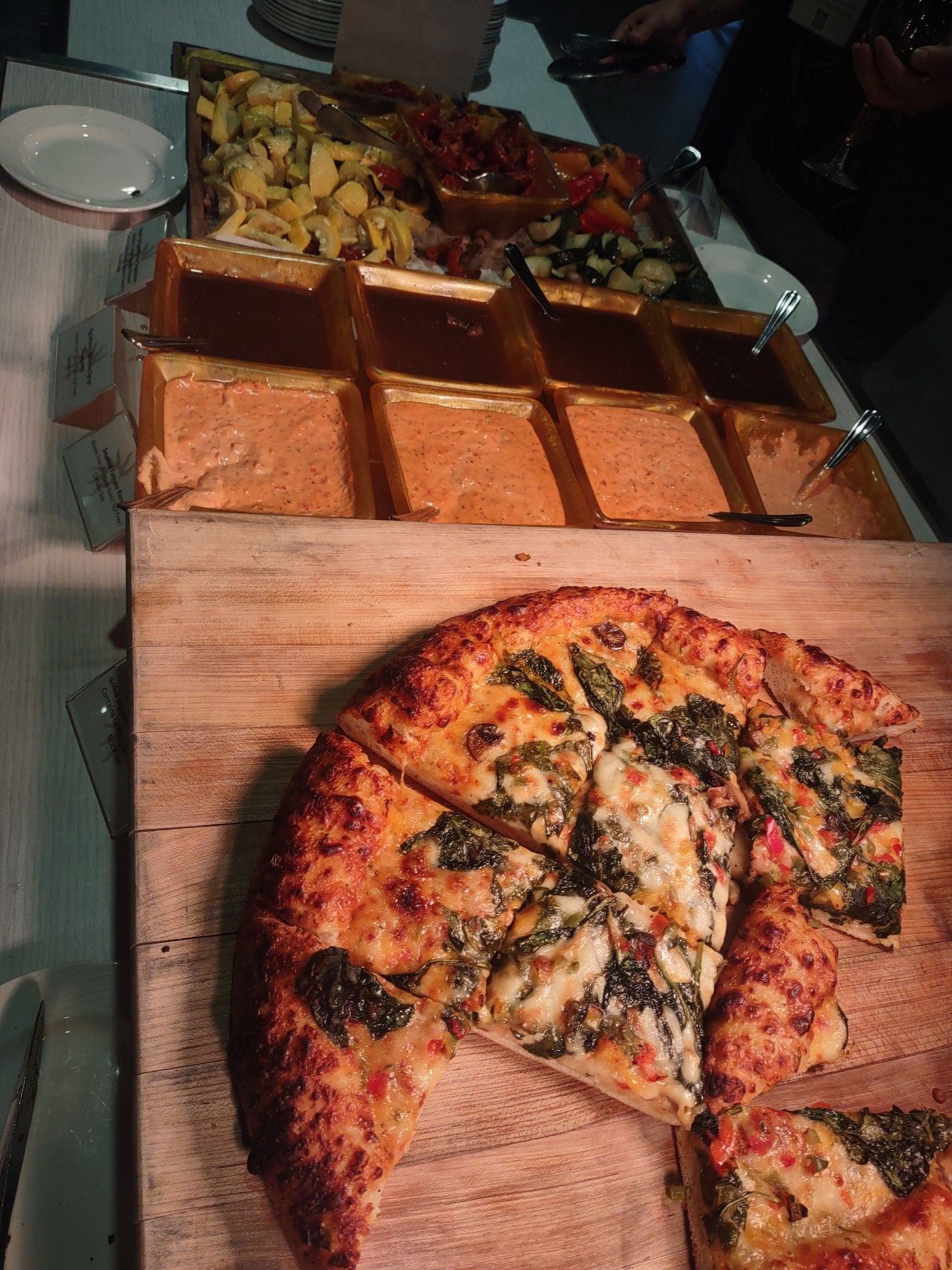 Pizza, veggies, and dipping sauces