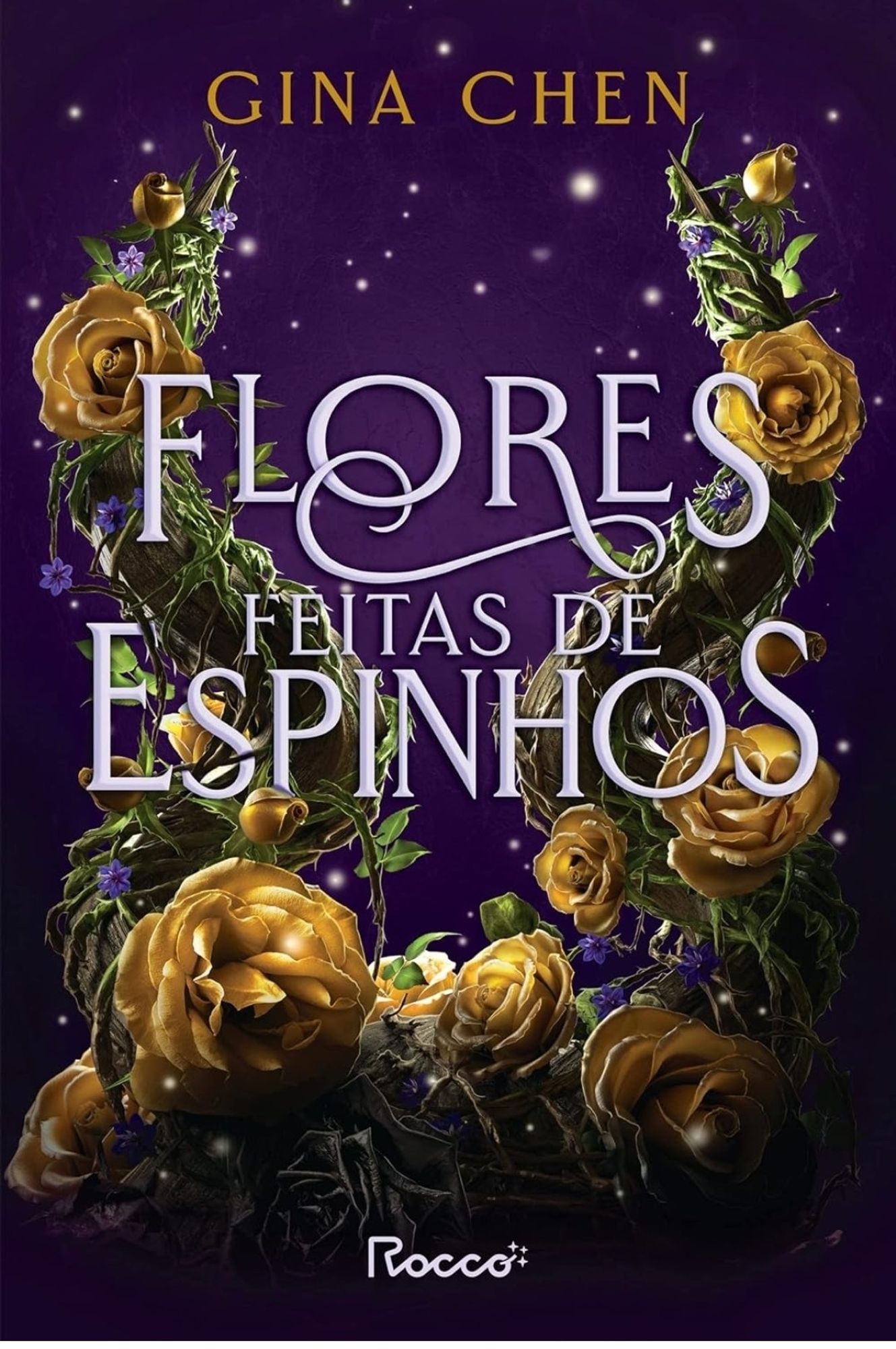 Livro Flores feitas de espinhos 
Capa com flores amarelas e fundo violeta ,as flores amarelas parecem dois chifres sobressaindo em uma espécie de pérgola 
da editora Rocco