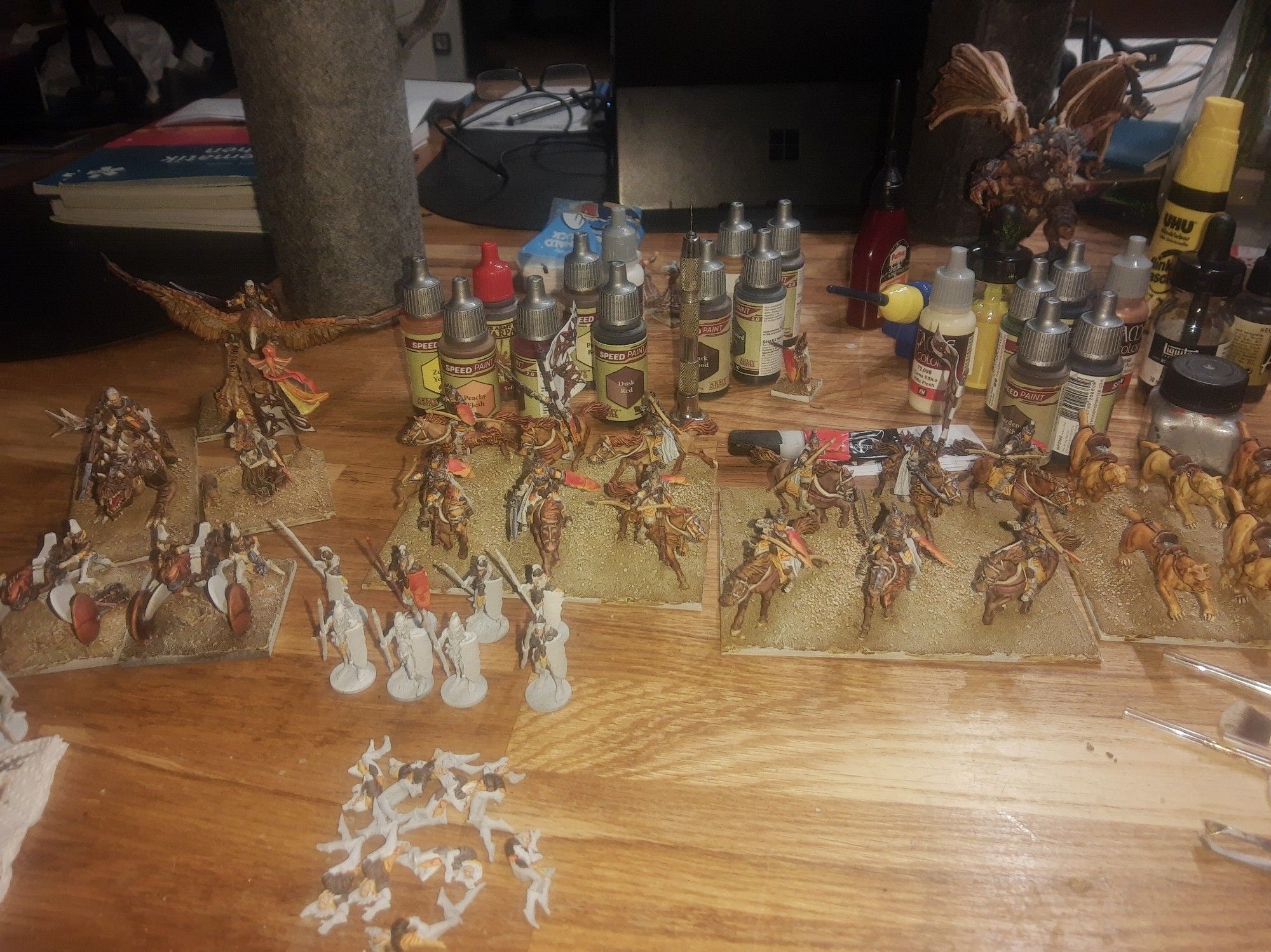 Mantic Games Elves Heroes, Warmachines and light Cavalry painted, Infantry partly painted and Army Painter Speedpaints in the background