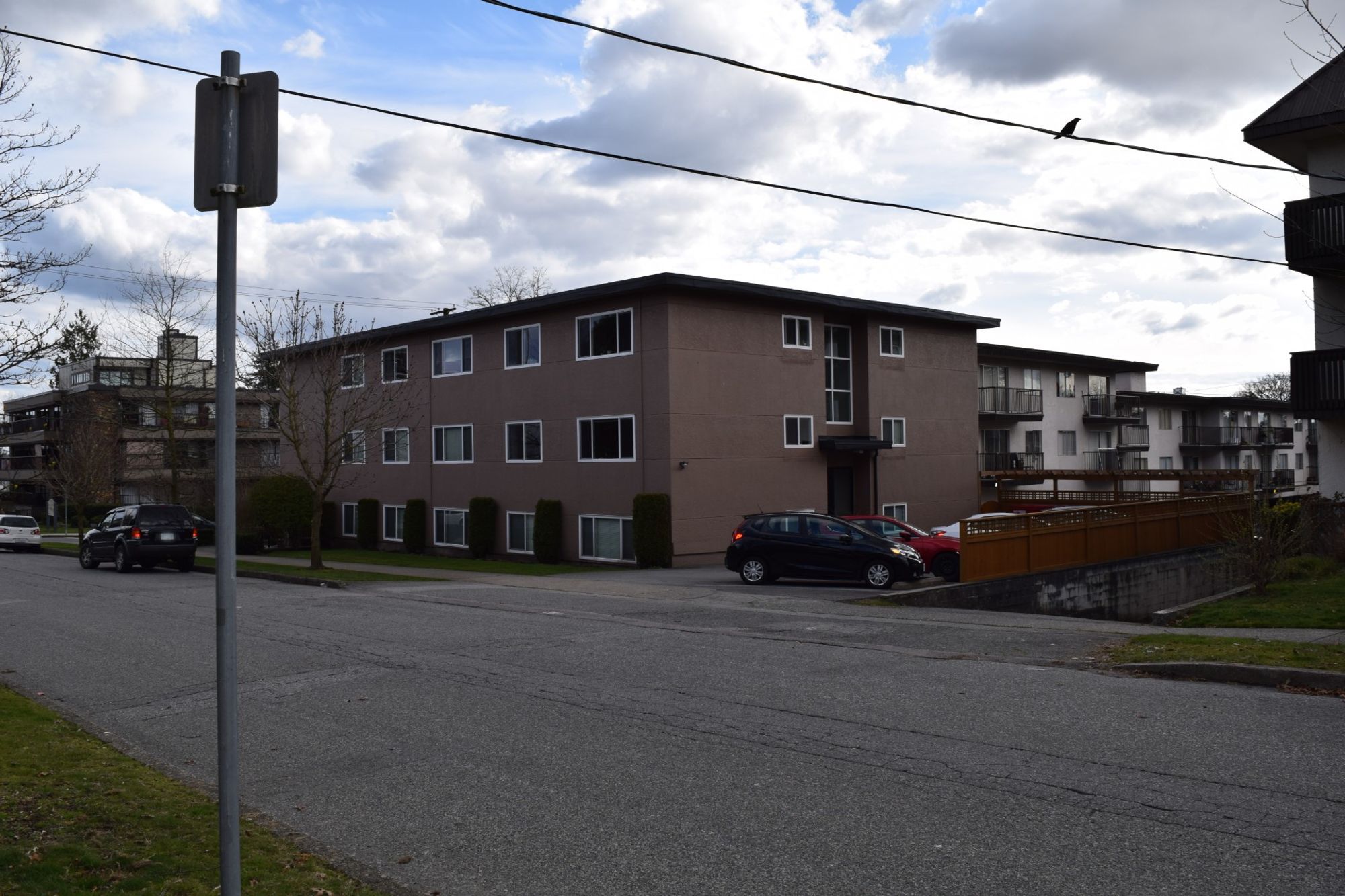 three-storey apartment building on corner lot