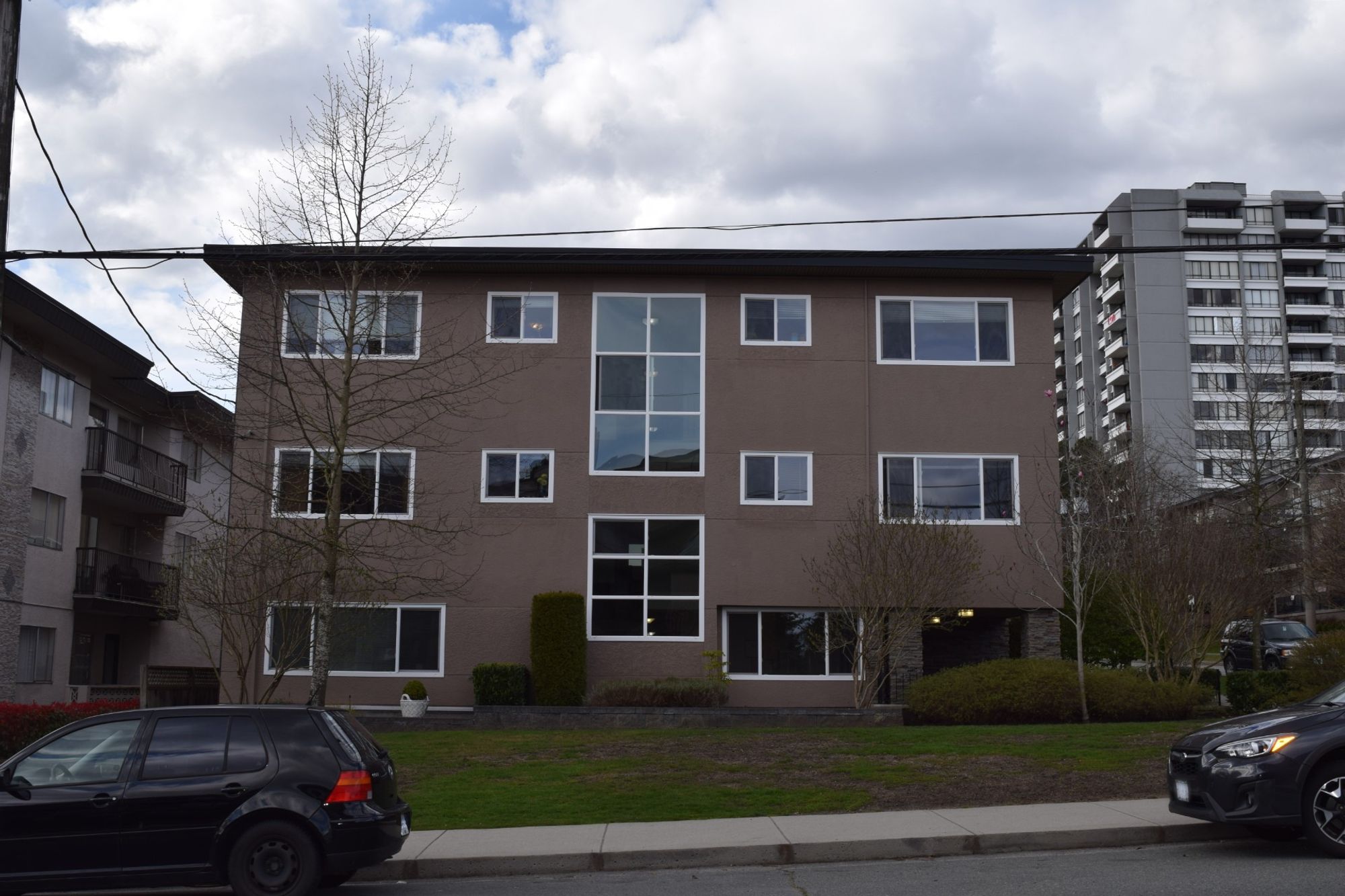 three-storey apartment building on corner lot