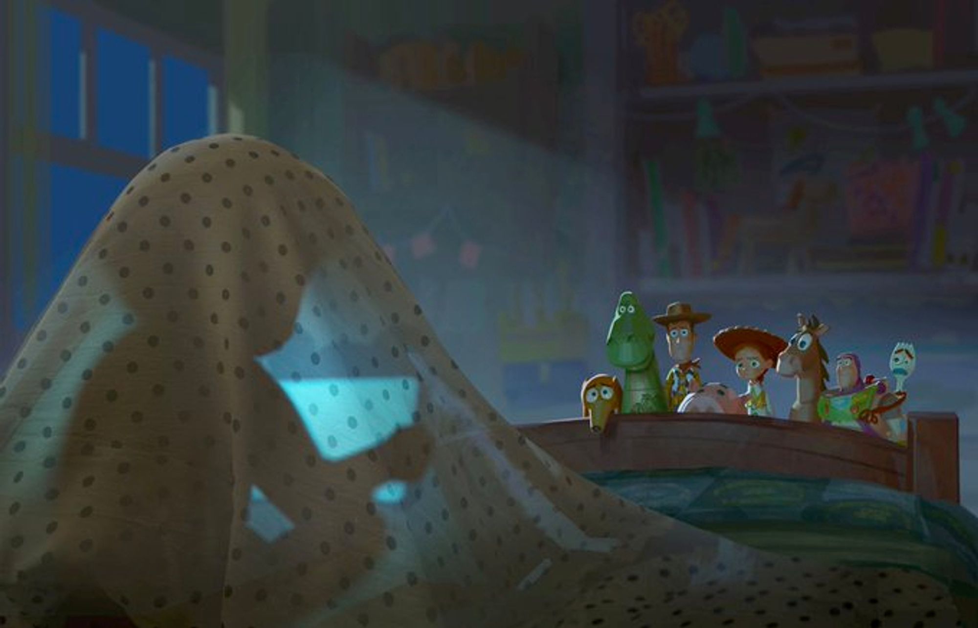 Concept art for Toy Story 5. Bonnie hides under her covers at night. We see her silhouette through her sheets thanks to the glowing tablet that she's playing with. Buzz, Woody, and the other toys are standing at the foot of Bonnie's bed, looking very dejected now that Bonnie has seeming lost interest in her toys to play with those darn tablets kids love so much these days.