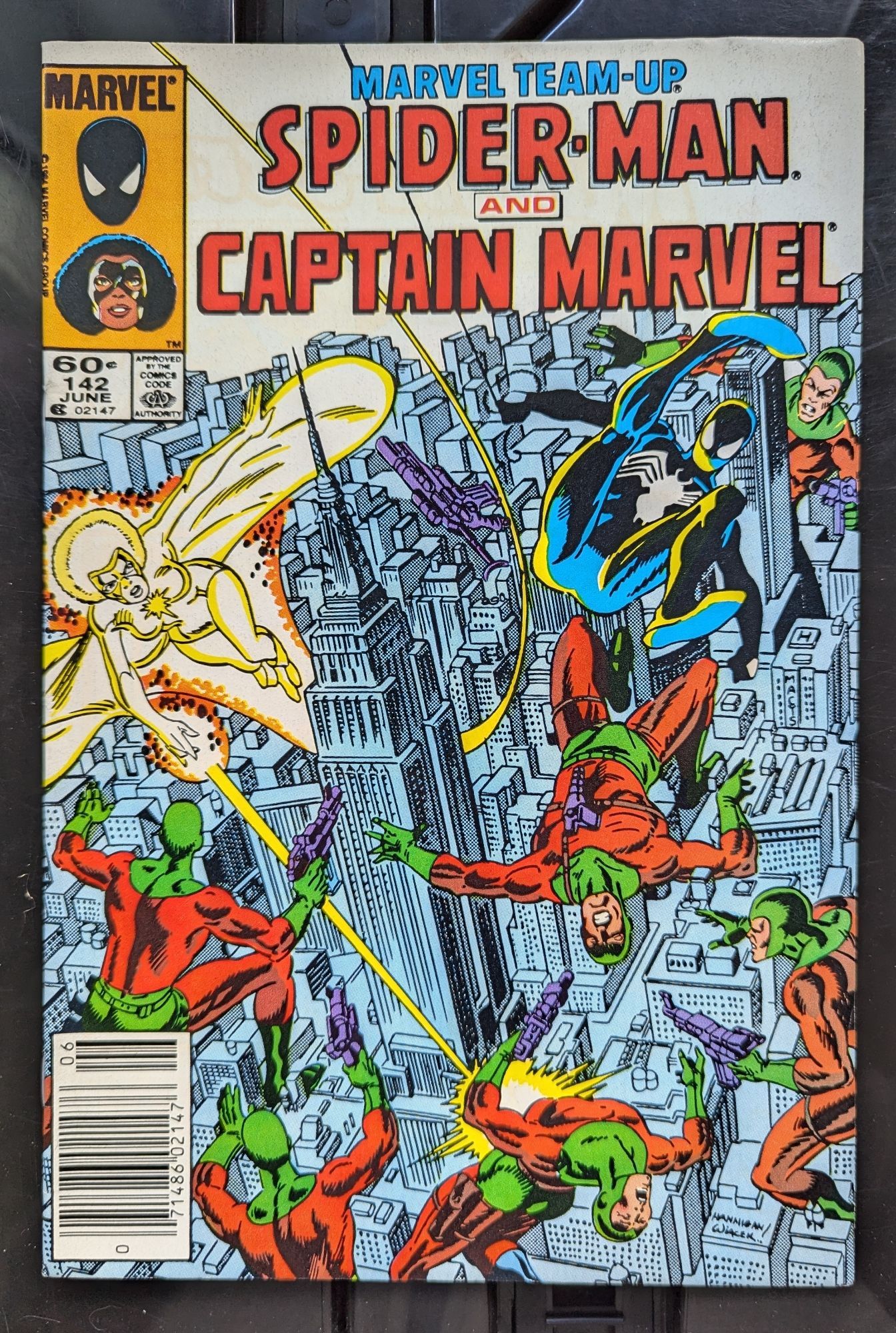 Cover, high over New York Spidey and Captain Marvel fight lackeys in Green and orange