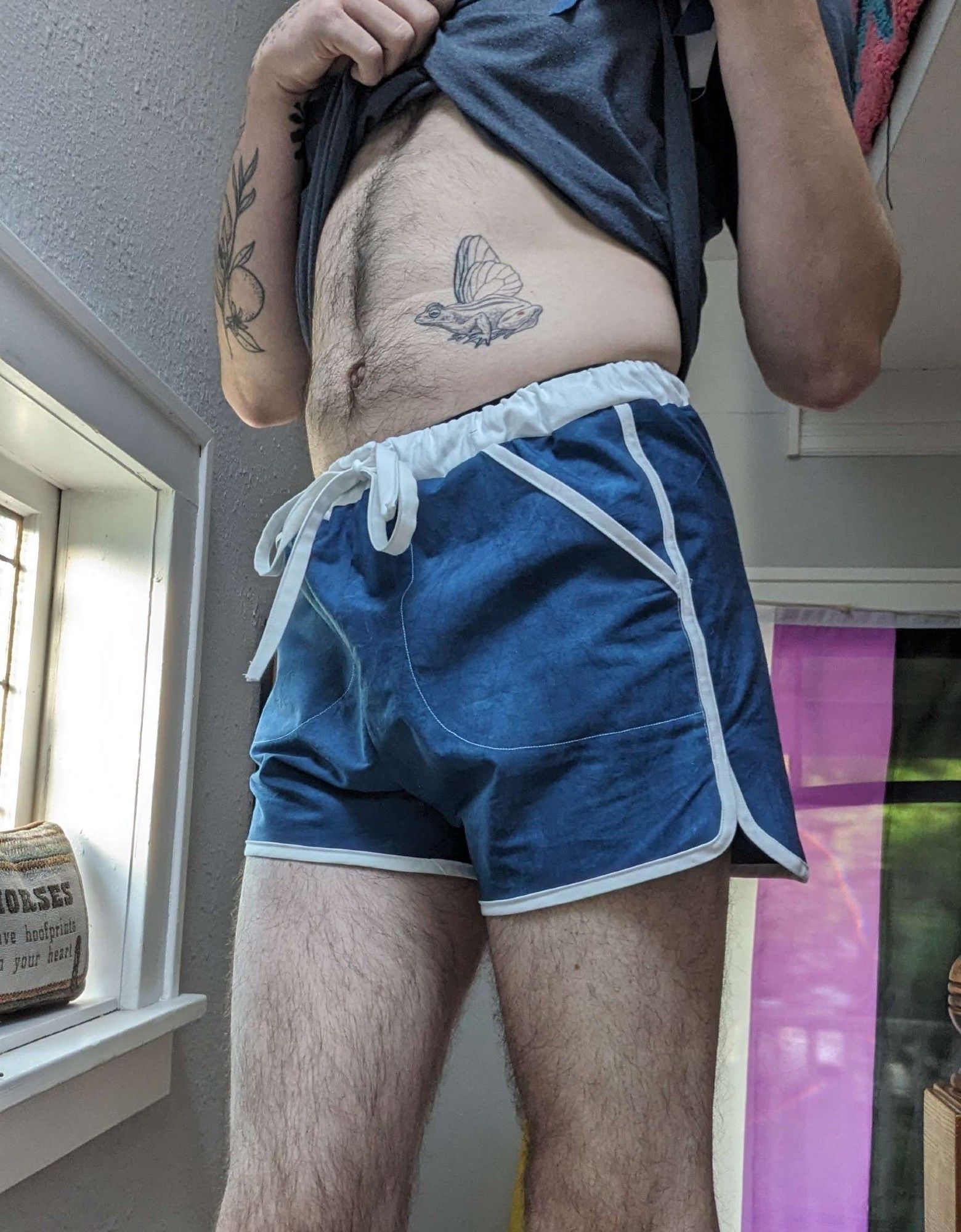 me wearing a pair of handmade blue and white shorts