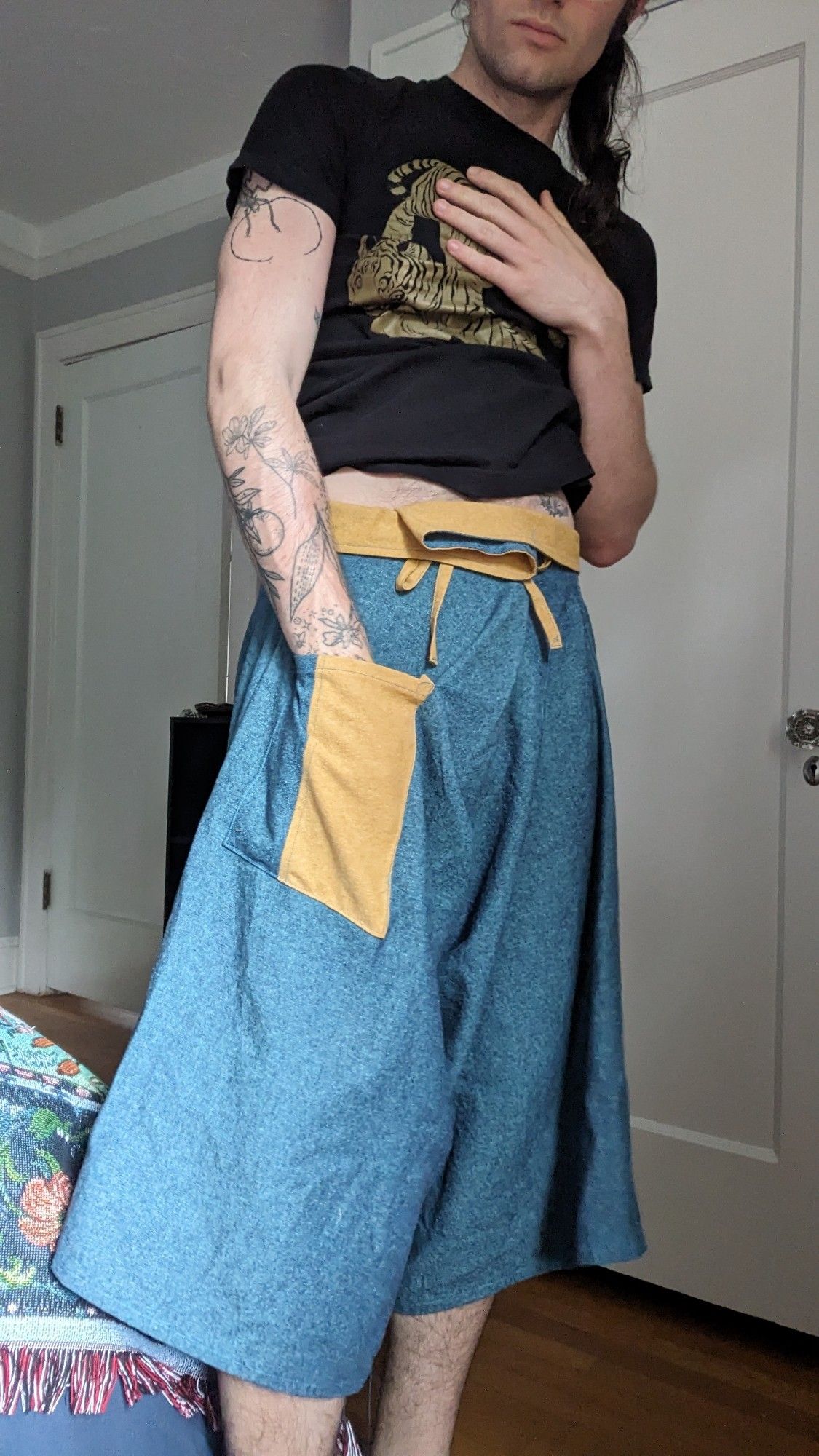 a pair of blue and mustard flowy handmade pants