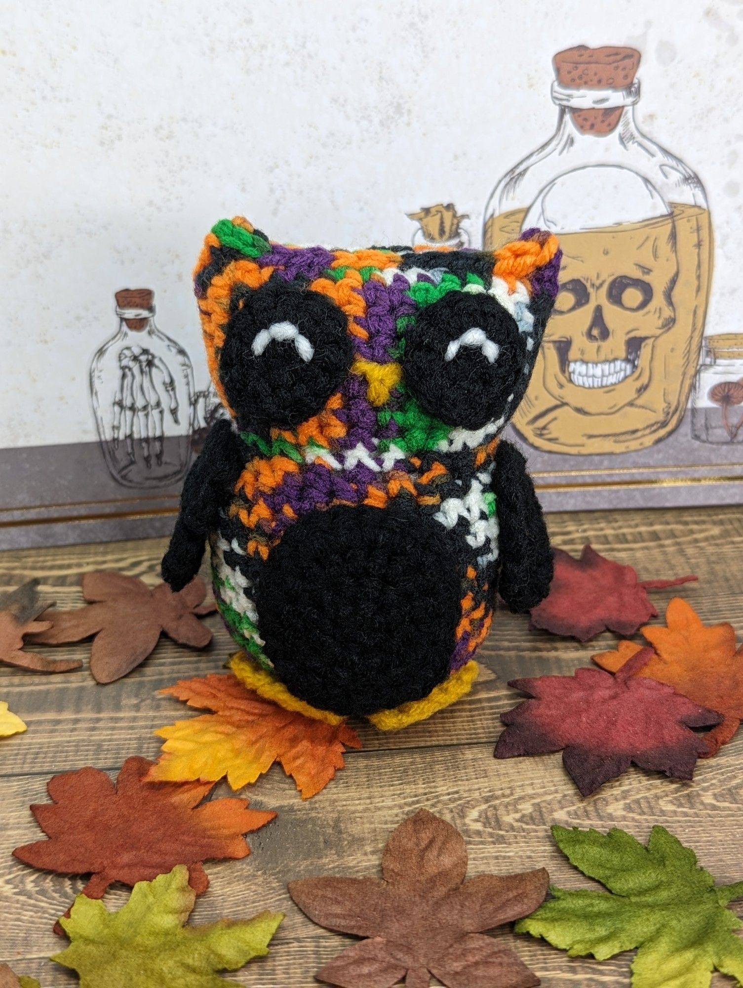 A multicolored crocheted owl