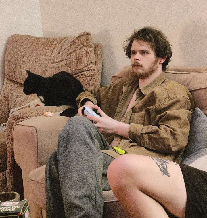 Me playing video games as I chill with Bela the cat