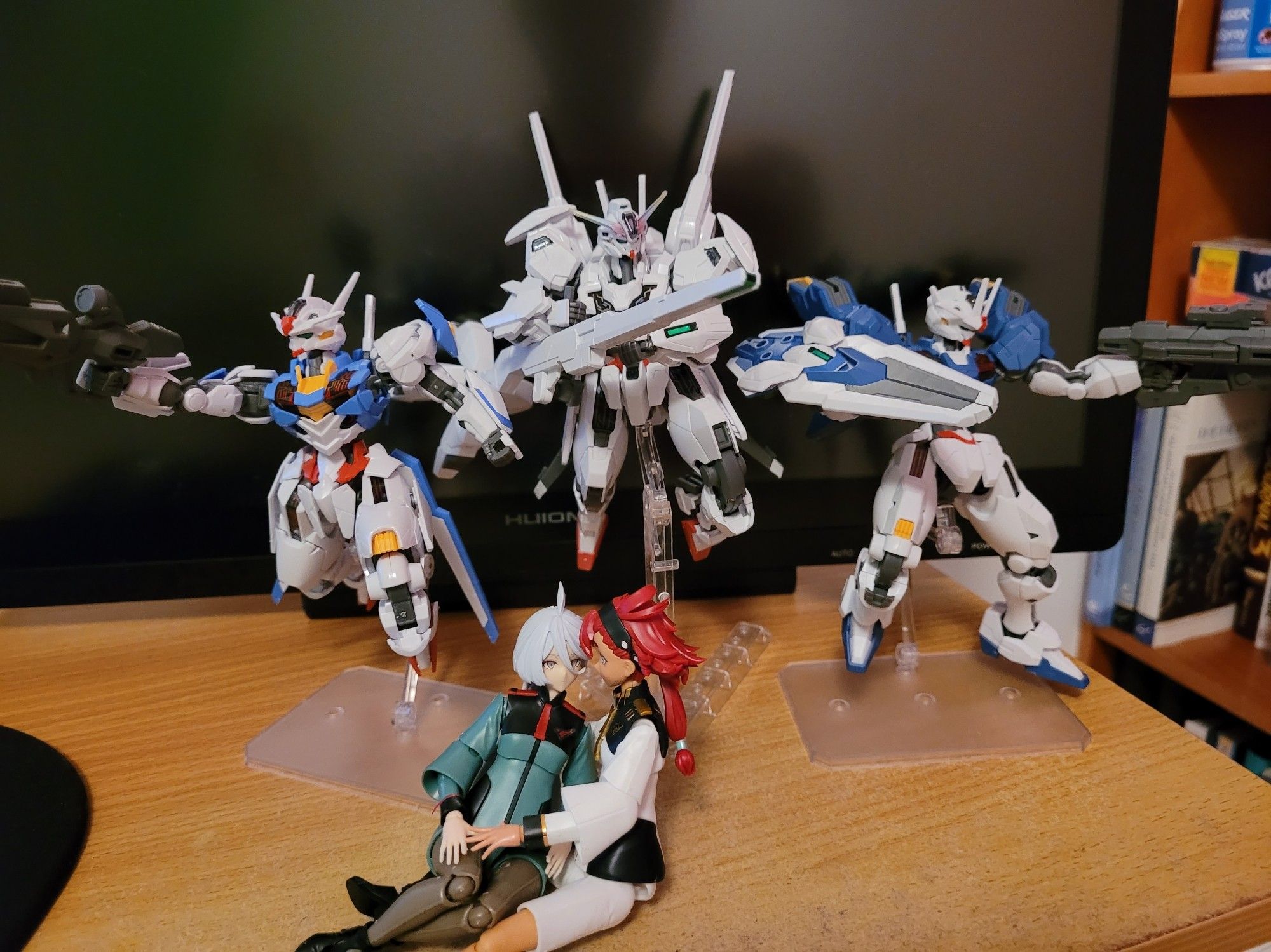 Five model kits from Gundam Witch from Mercury; Gundam Aerial, Calibarn and Aerial Rebuild in the back with Miorine and Suletta in the front