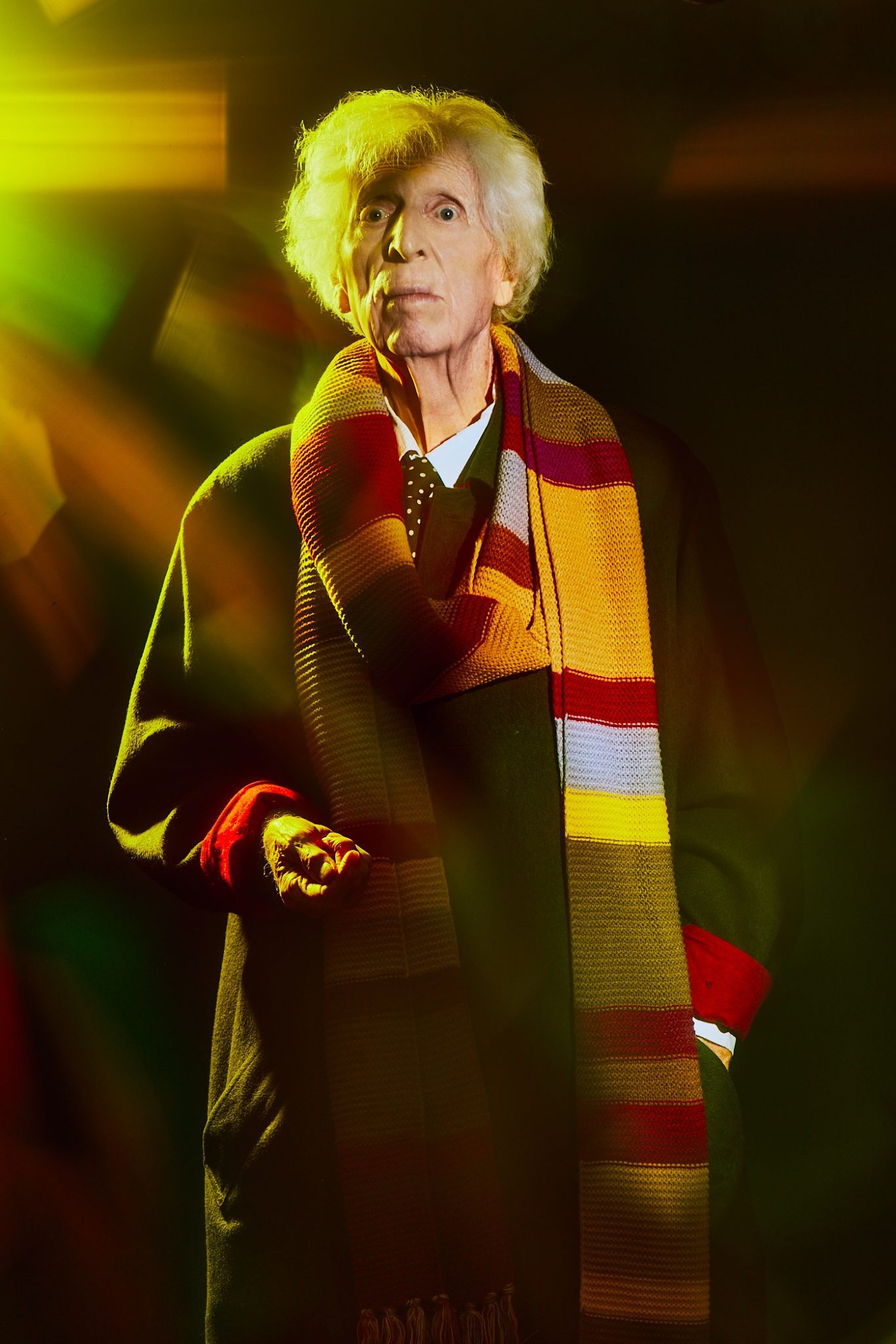 Tom Baker at 90 in full-on Doctor Who mode with long scarf and piercing stare - photograph by Yoshitaka Kono