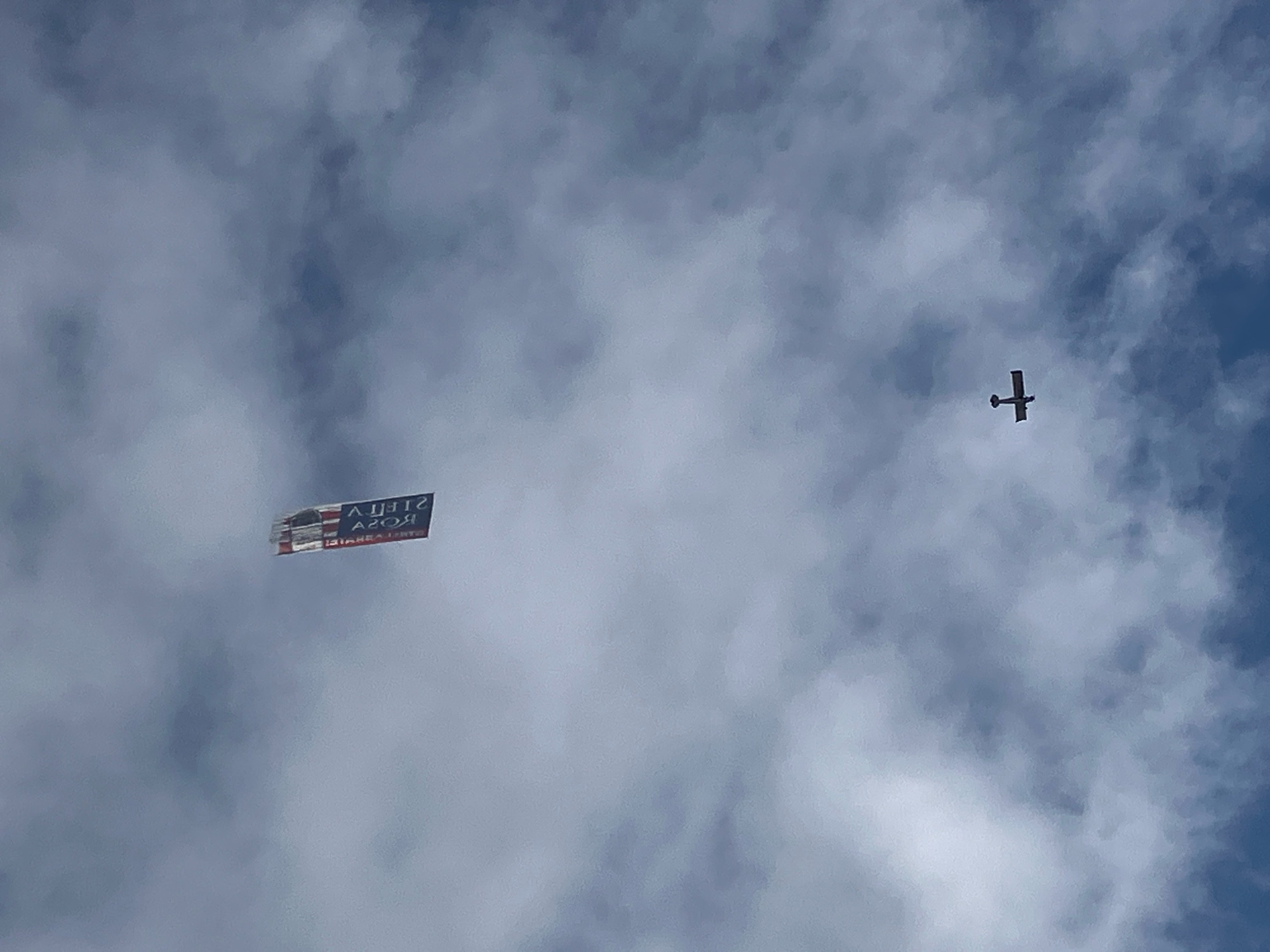 Plane flying a banner in the sky