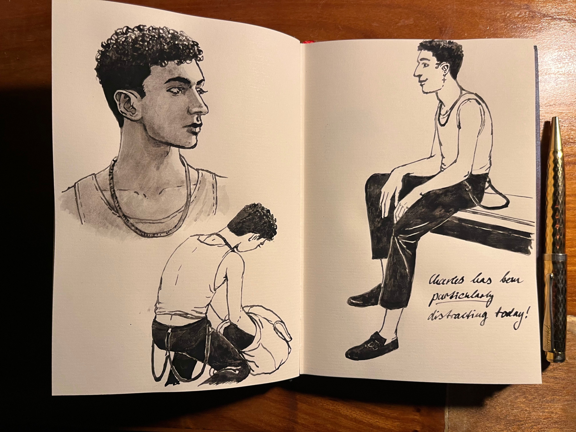 Double page spread of a small notebook with three ink drawings of charles (portrait, Charles kneeling on the floor with one arm inside his backback, Charles sitting on a desk). He is wearing his undershirt in all of these sketches. On the right hand page, Edwin has written: Charles has been particularly distracting today! (the word distracting is underlined)