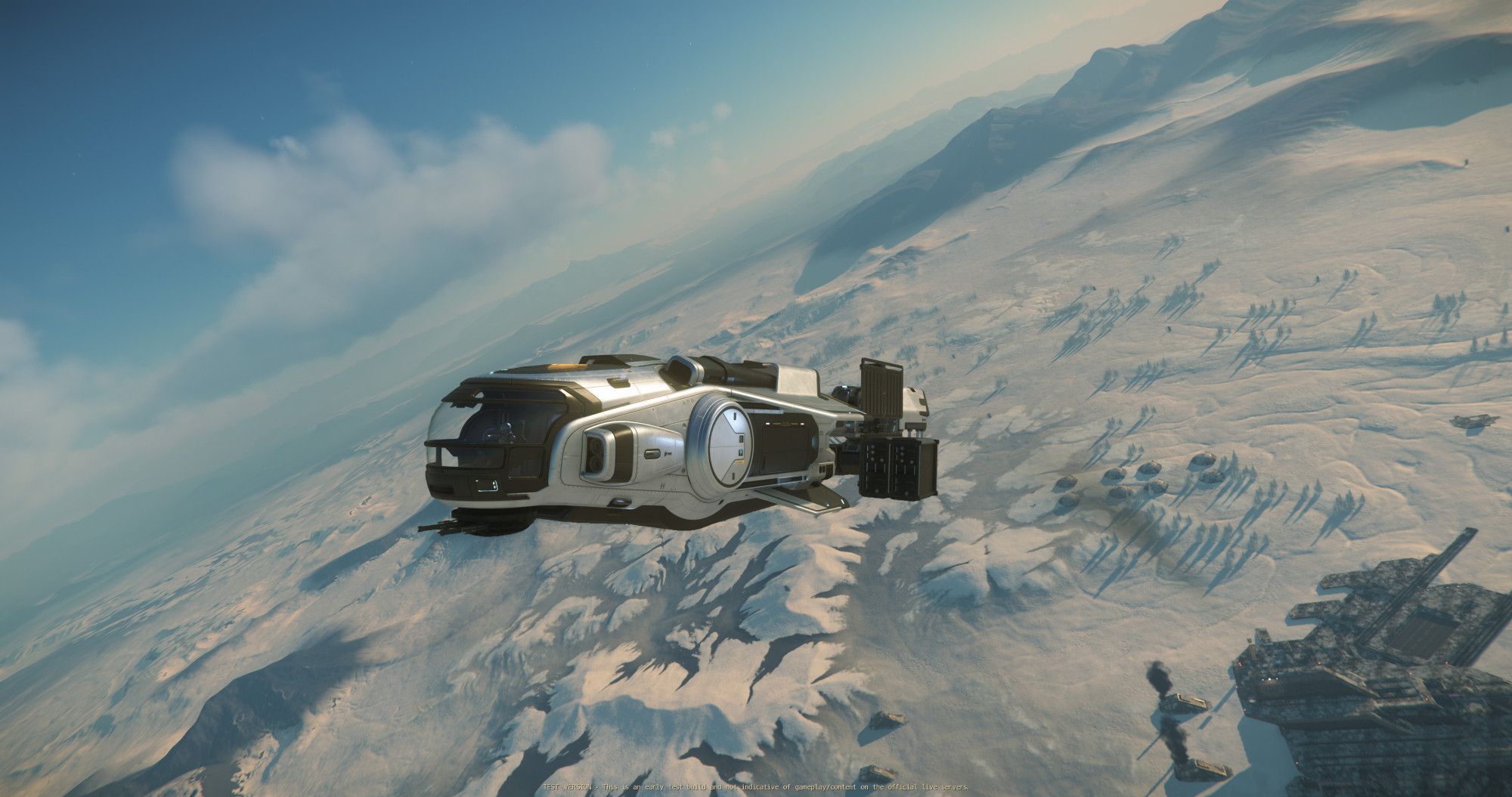 A silver MISC Hull A with a partial load of cargo flies away from a distribution center on snowy microTech in the game Star Citizen.