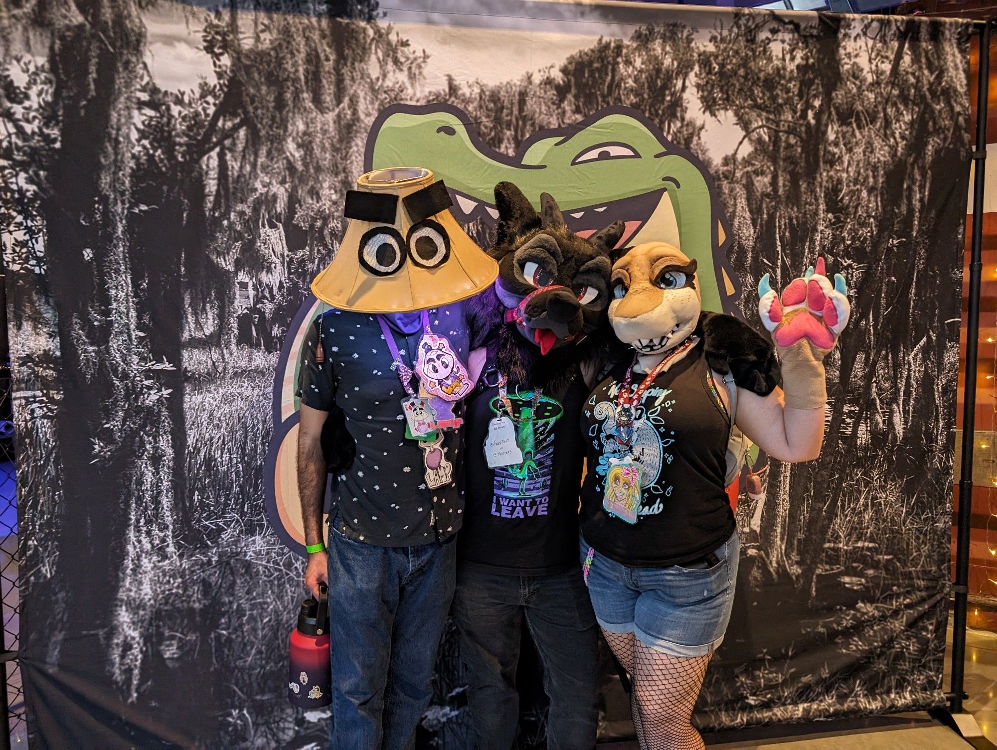 3 suiters standing in front of chomp FL banner