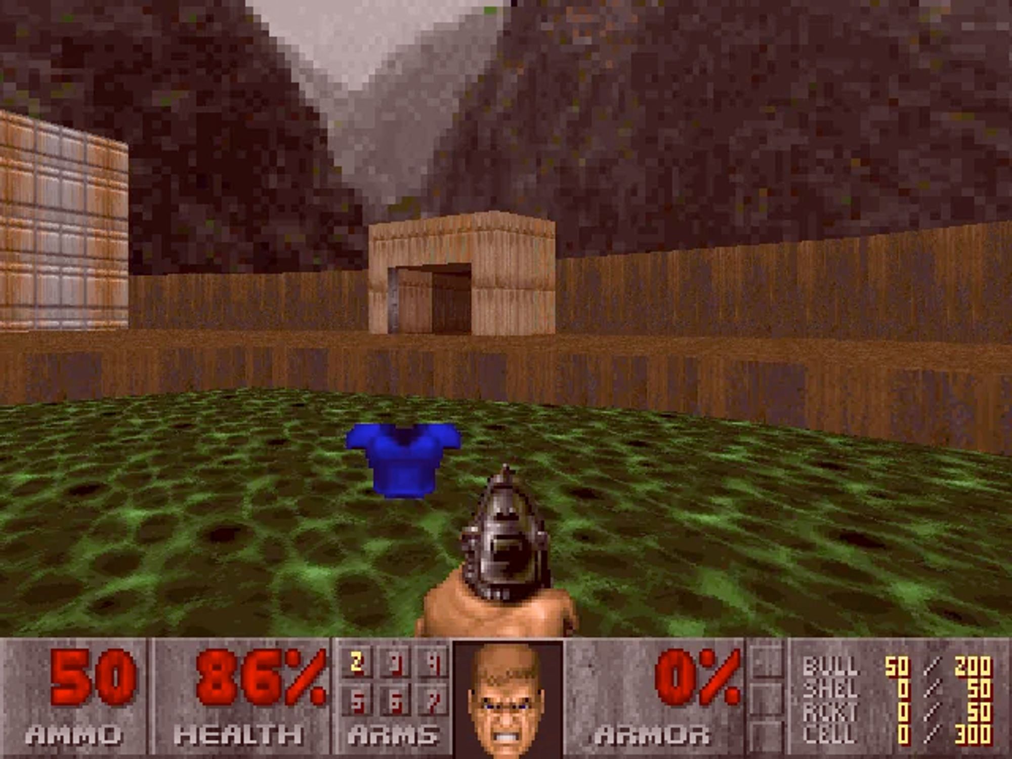 Screenshot from the original video game Doom. Doomguy walking through bright green toxic sludge. The screen is slightly tinted red and Doomguy is wincing, indicating that he is taking damage.