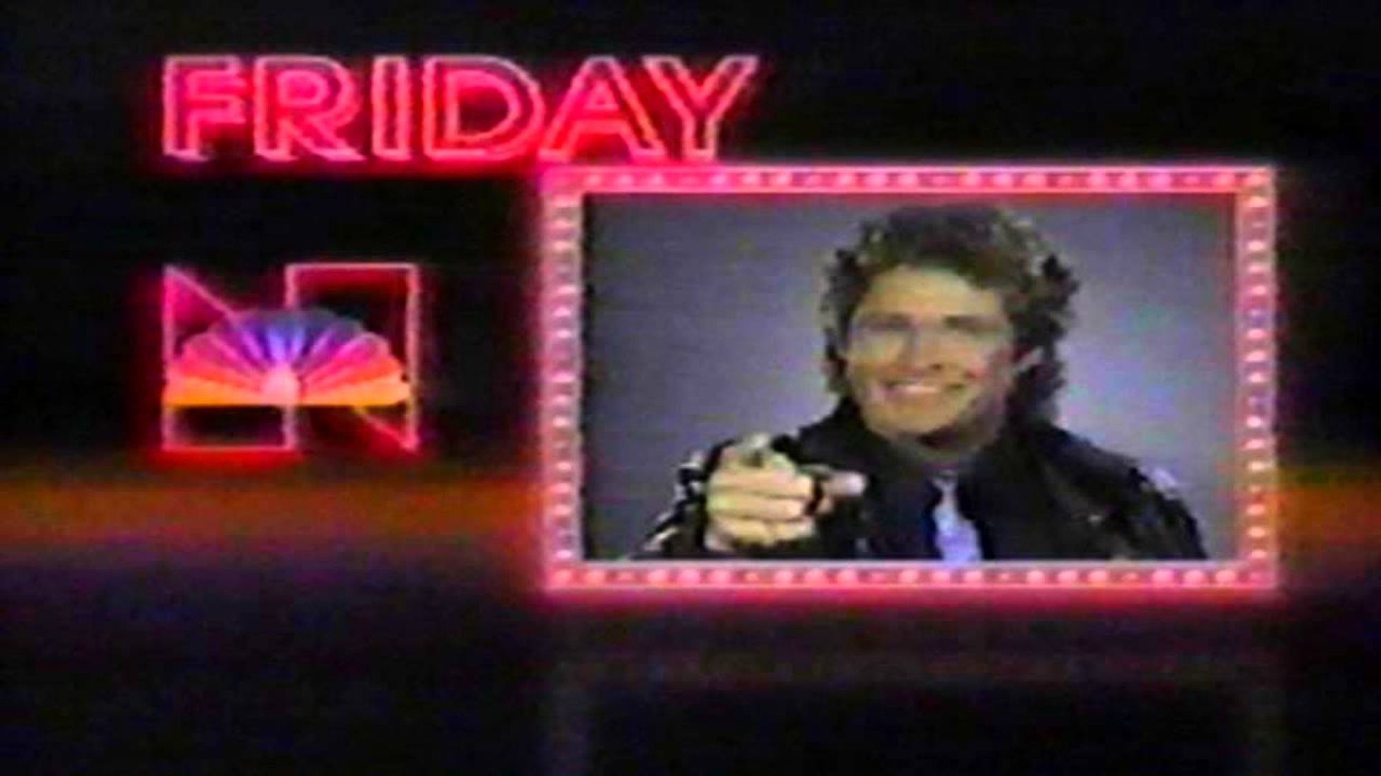 Screencap of 1980s NBC TV promo segment, wherein David Hasselhoff is pointing, smiling, and bidding you a great Friday.