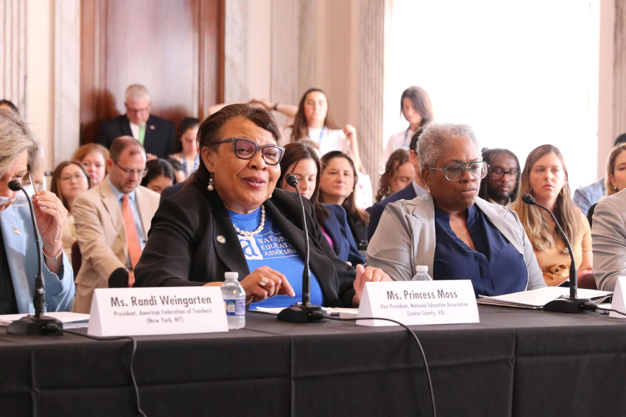Image of NEA Vice President Princess Moss speaking at Senator Hirono's Capitol Hill forum in Washington, DC next to Randi Weingarten and Denise Forte.
