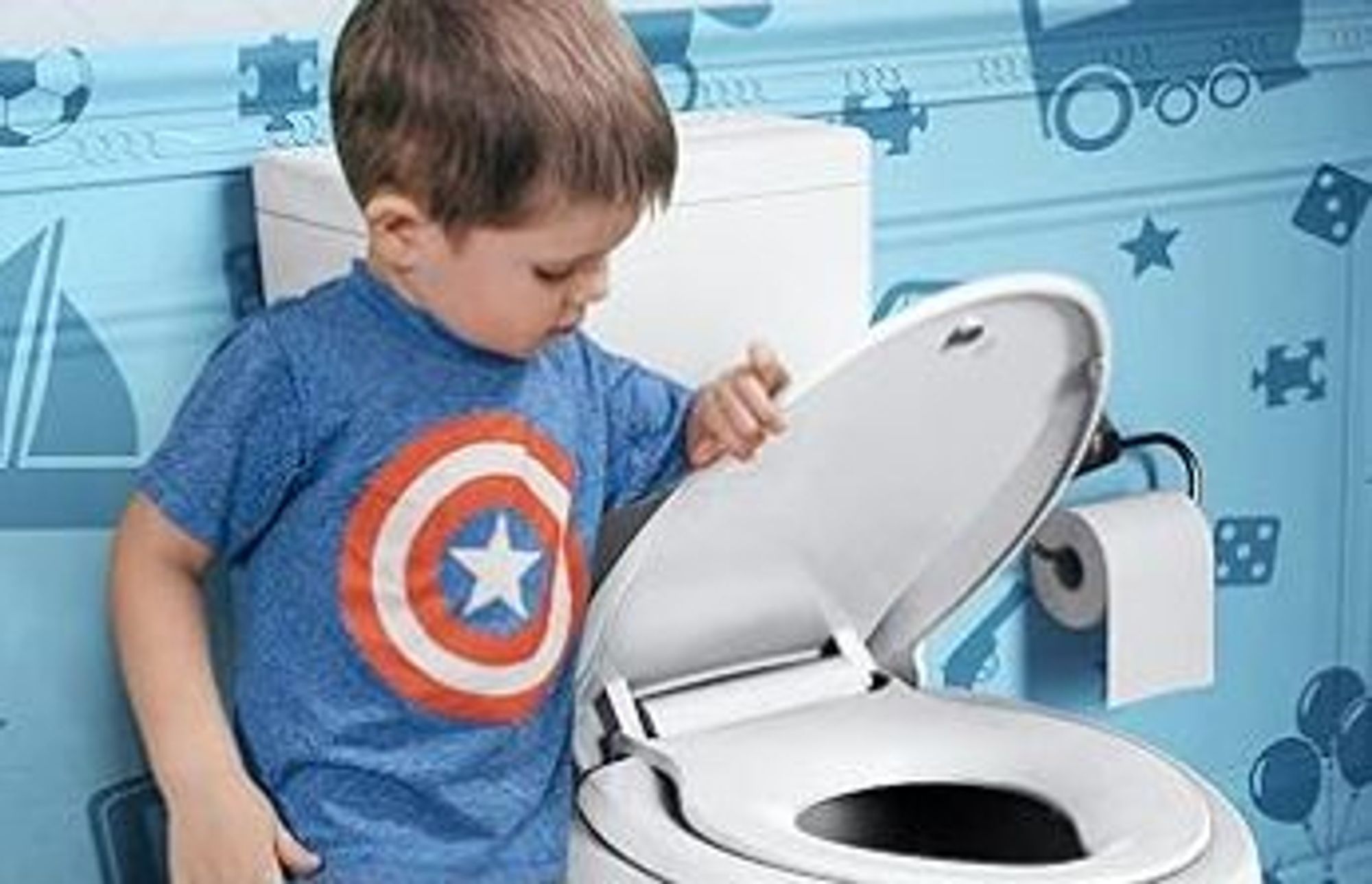 small child wearing Captain America t-shirt closing the toilet lid