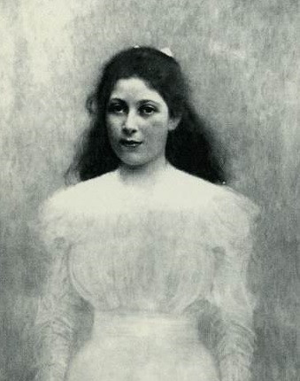 dark-haired girl in ghostly white dress engages the viewer with her direct gaze 