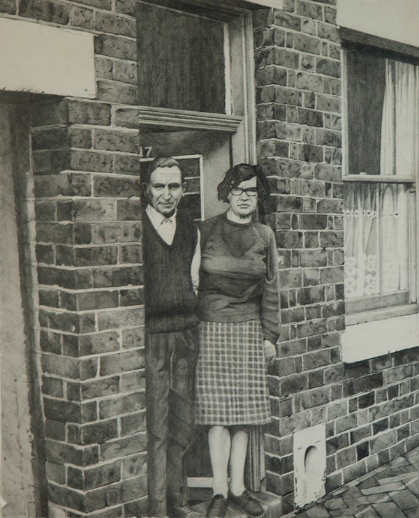 artist's father and mother stand at the open front door of their small brick home