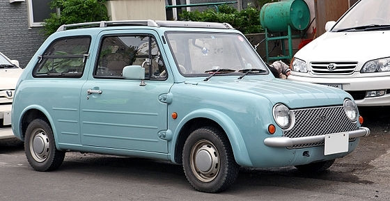 The Nissan Pao in Aqua Gray. It is a Hatchback based on the Nissan Micra.