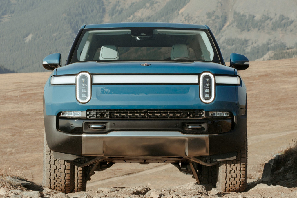 a view of the front grill of a Rivian electric truck, which features headlights that look an awful lot like the eyes of the mascot in the OP