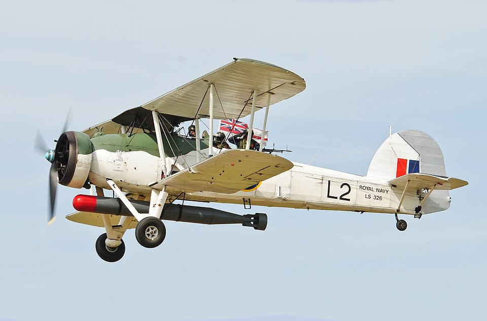 British Swordfish biplane carrying its torpedo