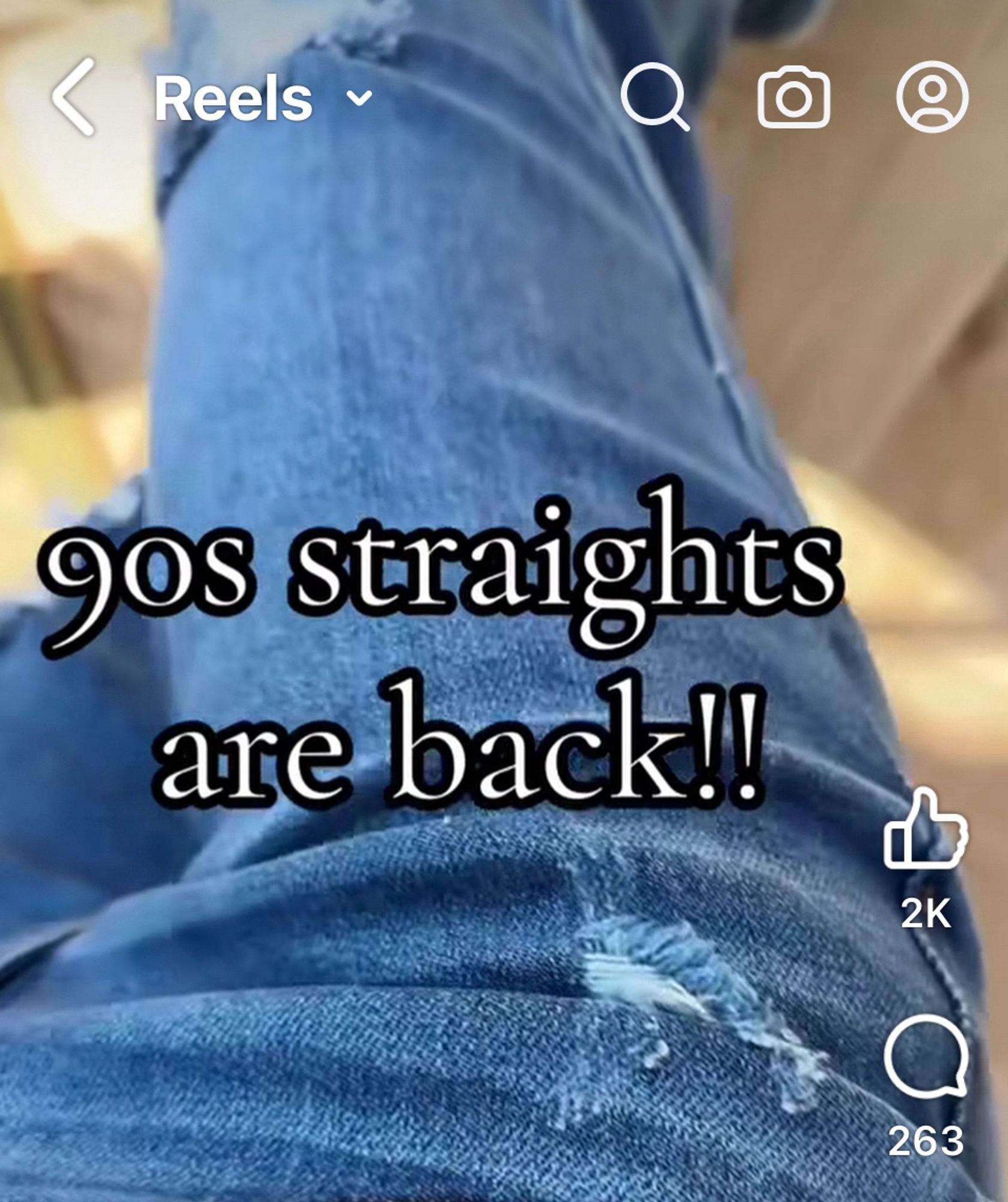 A screen capture photo of an advertisement for distressed, faded blue jeans, captioned “90s straights are back!!”